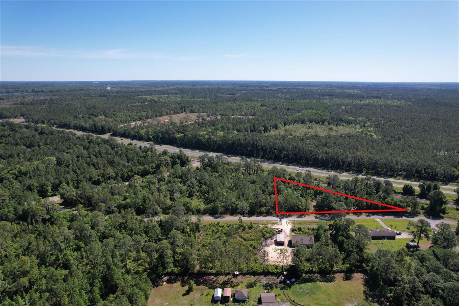 One or more photo(s) has been virtually staged. 1.02 acres buildable lot! Discover the epitome of Florida living on this vacant lot just moments from the shores of Lake Lochloosa. Home to some of the best fishing in Florida and so much more...  Positioned mere minutes from Gainesville, home to the esteemed University of Florida, and within easy reach of Ocala, this parcel of land offers both convenience and tranquility.  This property may be sold individually or as a package = 4.4 acers of land. Ask for details.