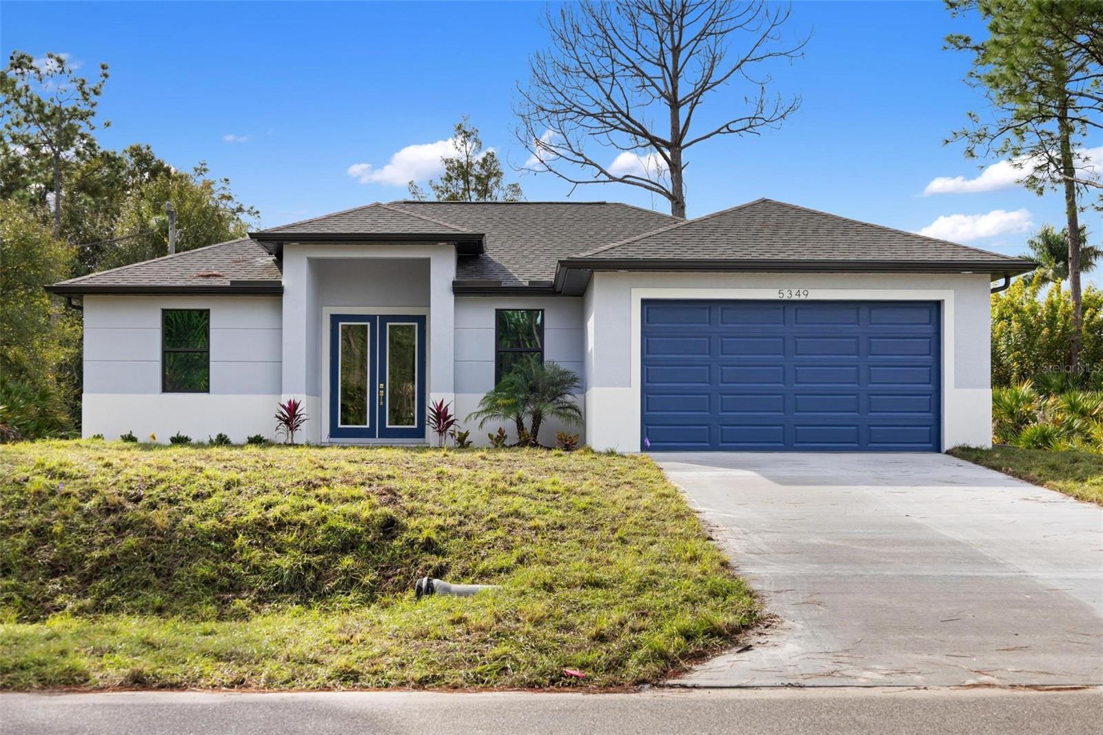 Welcome to a stunning example of modern luxury living in the highly desirable city of North Port. This brand-new 2026 fully custom-built MODEL HOME showcases exceptional craftsmanship, upscale finishes, and a thoughtfully designed layout that perfectly blends sophistication with everyday comfort. Spanning 1,650 square feet, this BEAUTIFUL 4-bedroom, 2-bathroom home features a bright open-concept floor plan highlighted by soaring 10’4” ceilings, elegant tray ceiling details, and oversized double glass entry doors that flood the interior with natural light. Throughout the home, impressive 32x32 porcelain tile flooring enhances the clean, contemporary aesthetic while creating a seamless flow from room to room. The designer kitchen serves as the centerpiece of the home, crafted to impress both visually and functionally. It features Level 4 quartz countertops with dramatic waterfall edges, full wood soft-close cabinetry, stylish pendant lighting, stainless steel appliances, a charming farmhouse sink, and decorative hardware accented with refined gold trim, creating a space that feels both luxurious and welcoming. The expansive primary suite offers a true private retreat, complete with dual walk-in closets and a spa-inspired bathroom showcasing a floor-to-ceiling tiled shower with modern 64x12 tile, dual-sink vanity, and elegant designer mirrors and fixtures. Additional bedrooms are generously sized, while the fourth bedroom provides the perfect space for a home office, den, or flexible living area. Premium upgrades continue throughout the home and include:

* Impact-rated front door and bronze impact windows * Electric fireplace * Whole-home water softener system * Full irrigation system * *Professional landscape package * Plus a worry free complimentary 10-YEAR HOME WARRANTY * 

Ideally situated in the growing community of North Port, the property offers convenient access to Interstate 75, HWY 41, the brand-new, soon-to-be-built state-of-the-art hospital, plus quick access to some of the area's finest shopping, dining, parks, schools, warm mineral springs and more.

This exceptional new construction home combines modern luxury, high-end finishes, and a prime location—an outstanding opportunity to experience the very best of Florida living. So don't let your Florida dream home become someone else's address, set up your showing today! ** Be Sure To Check Out the Beautiful Fly Through Video of This Gorgeous Home **