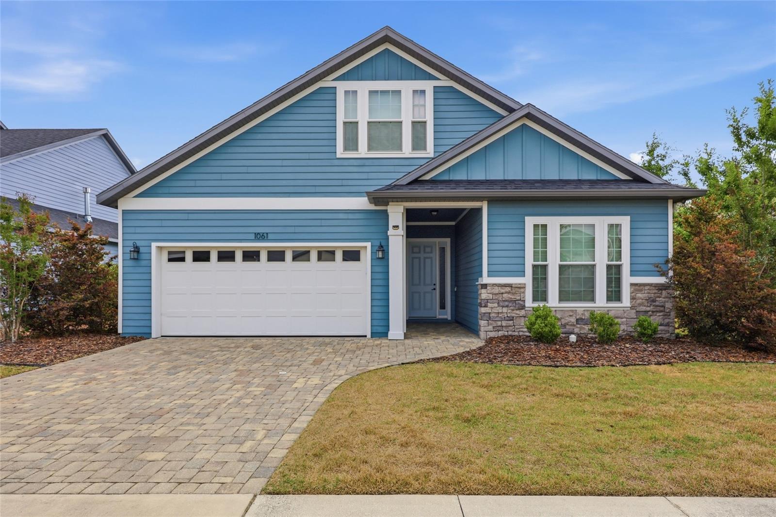 One or more photo(s) has been virtually staged. Backing up to serene common space in desirable Arbor Greens in west Gainesville, this beautifully crafted 2018 Robinshore home offers a tranquil setting within one of the area’s most sought-after communities. Featuring 4 bedrooms, 3 bathrooms, and a spacious bonus room, the layout provides flexibility and room to grow while maintaining a comfortable, easy flow.
A long foyer creates an inviting first impression and leads into a split floor plan that balances openness with separation of space. Two bedrooms and a shared bathroom are positioned toward the front of the home, ideal for guests or additional living needs.
At the heart of the home, an expansive great room brings together the kitchen, living, and dining areas into one cohesive space that feels both open and connected. The chef’s kitchen is designed for everyday living and entertaining, featuring a large island with breakfast bar seating, upgraded solid wood cabinetry, granite countertops, a gas cooktop, abundant prep space, and a walk-in pantry. The adjoining dining area and living room offer generous space to gather, all enhanced by natural light streaming in from multiple windows and sliding glass doors that lead to the covered patio.
On the opposite side of the home, the primary suite serves as a comfortable retreat, complete with a spacious walk-in closet, large shower, dual vanities, and a separate water closet. A nearby fourth bedroom offers flexibility as a study, office, or additional guest space.
With no carpet in sight, tile and laminate flooring run throughout the home and bedrooms, offering durability and a clean, cohesive look.
Upstairs, a large bonus room with a full bathroom and wet bar creates the perfect space for relaxing, entertaining, or hosting extended stays. The laundry room, conveniently located near the primary suite, connects directly to the two-car garage, helping keep day-to-day living organized and contained.
Outdoors, the covered patio is ideal for enjoying fresh air and the natural backdrop. The fully fenced yard is manageable in size, with no rear neighbors and a conservation area along one side, creating a sense of openness.
Arbor Greens is a highly desirable community in the Jonesville area of west Gainesville, known for its beautiful surroundings, community pool, clubhouse, playground, trails, and convenient location, just minutes from Tioga Town Center, Publix, Starbucks, Aldi, restaurants, medical facilities, fitness centers, and more.

With its thoughtful layout, quality finishes, and proximity to top Gainesville amenities, this Arbor Greens home offers a well-rounded living experience in a community that continues to be in high demand.