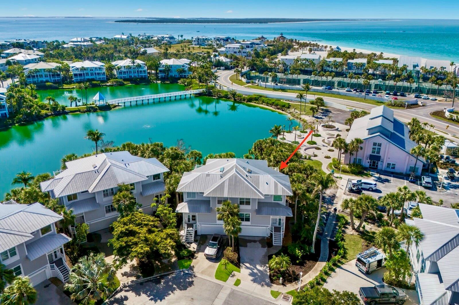 Sleekly updated and beautifully positioned, this 3-bedroom, 3-bath Kentia townhome in Boca Bay’s desirable South Village offers a rare blend of tranquil water scenery, exceptional natural light, and partial Gulf views from its private top-level sundeck. Completely remodeled throughout, the main living level showcases an airy coastal layout with durable, low-maintenance wood-look tile flooring—ideal for a waterfront environment. The reimagined kitchen features high-end Thermador appliances, custom cabinetry, and a sophisticated bar with dual beverage refrigerators, perfect for effortless entertaining.
Custom built-ins, an electric fireplace, and integrated LED lighting elevate the living area, while the expanded waterside porch—fully enclosed and under air—provides additional year-round living space. Electric roll-down screens allow you to open the sliders and welcome in the Gulf breeze while preserving crystal-clear lake views unobstructed by traditional screening when not in use, creating a seamless indoor–outdoor experience.
Upstairs, the primary suite opens to a private sundeck ideal for enjoying soft Gulf breezes, serene water vistas, and dramatic evening skies. Two additional bedroom suites, each with a fully renovated bath, ensure comfort and privacy for family and guests. A ground-level lakeside patio offers another relaxed outdoor setting, enhanced by the generous and private feel of the end-unit location—an ideal spot for grilling and complete with a convenient outdoor shower area for rinsing off after a day at the beach.
Practical upgrades include a 2018 metal roof, impact-rated windows and doors, and an additional laundry hookup in the garage for a second washer/dryer option. A spacious 3+ car garage provides abundant storage for beach gear, bikes, and golf carts.
Just a short walk to the Boca Bay Pass Club, the residence offers convenient access to dining, fitness, tennis, and the beach, along with community swimming pools, pickleball courts, short-term boat dockage, a private fishing pier, and the Gulf-front Beach Club.
Blending modern upgrades with an exceptional waterfront location, this beautifully transformed Kentia townhome offers a rare opportunity to enjoy the very best of Boca Grande’s coastal lifestyle.