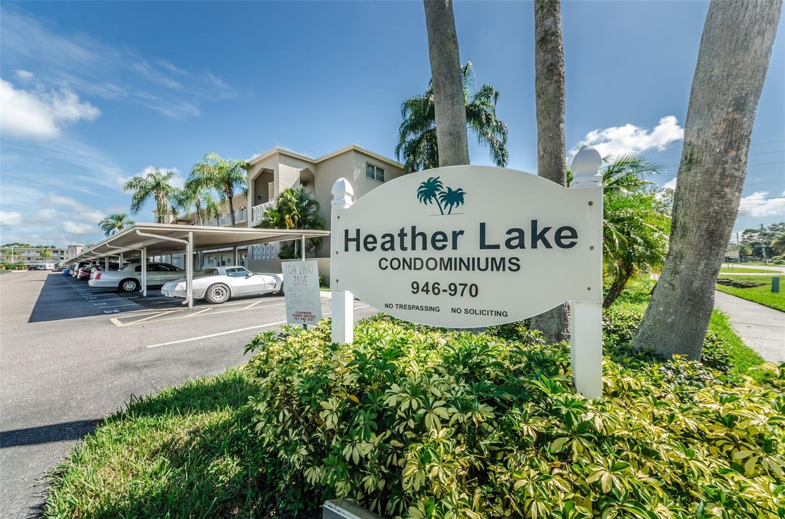 This light bright 2 bedroom condo is just steps from it's assigned carport. No stairs or elevators to struggle with. Enjoy the tranquil pond view from the enclosed sun porch or sit outside on your private patio. The community laundry is nearby for your convenience.  Fresh neutral paint compliments the new luxury vinyl plank floors and baseboards. A large living room and separate dining area are great for entertaining. Light kitchen cabinets, light counters, subway tile backsplash, double ceramic sink and white appliances. Enjoy your morning cup of coffee on the sun porch with eastern exposure. Two large bedrooms, one with walk-in closet and access to the sun porch. Updated bathroom with easy access tub, new vanity, mirror and lighting. Updated electrical panel and 2021 water heater. 2007 HVAC operates well. A short walk to Dunedin's downtown village for shopping, dining, live music, marina and year round festivals. Across the street is a full grocery, discount stores, pharmacy and more restaurants. Healthcare is in abundance, including a highly rated hospital just a few blocks away.  Heather Lake offers a heated pool, clubhouse, social activities and on-site management. Condo fees include fast internet, cable TV, water, sewer and trash. A truly maintenance free lifestyle that you can lock and leave with no worry.