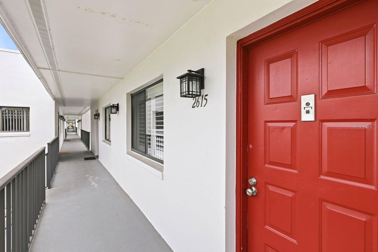 Step into this beautifully renovated, second-floor end unit that perfectly blends modern upgrades with a vibrant resort lifestyle. Flooded with natural light, this home features seamless luxury vinyl flooring throughout and an open-concept living and dining area designed for both relaxation and entertaining. Modern Upgrades & Features!  Every inch of this condo has been thoughtfully updated so you can move right in. The kitchen, completely remodeled with updated appliances, contemporary cabinetry, and stylish finishes. Spa-Like Bathrooms have been fully modernized with chic fixtures and contemporary tile. Primary Suite features a completely customized walk-in closet and a private, enclosed balcony—the perfect spot for your morning coffee or evening unwinding. Mechanical Peace of Mind: Major systems have been upgraded including a new A/C (2022) and a new hot water heater (2020}.  Includes a dedicated laundry closet equipped with a washer and dryer for ultimate convenience. Shutters on all windows and patio door. Convenience is at your doorstep. This prime location offers effortless access to Orlando International Airport (MCO), major shopping centers, dining, and daily amenities, making it ideal for frequent travelers and locals alike.