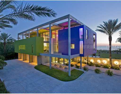 A VERY PRIVATE BEACHFRONT ESTATE: securely positioned behind the 24/7 guard gates in prestigious Sanderling Club, this stunning Architectural award-winner is jaw-droppingly gorgeous.  Exciting 36' ceilinged  ground level foyer welcomes guests in a gracious way.  The home lives and entertains with style and comfort.  Fabulous deep covered terraces on three levels offer opportunities for elegant outdoor living providing precious shade with a constant soft sea breeze to cool.  Grand-sized common area rooms with sunset and Gulf views from every one of them offer both formal living and dining room and casual family room open to kitchen.  Sensational master suite with his and her baths and dressing areas features its' own private Gulf-view terrace and a roof garden for morning coffee and serenity.  Family wing is separate and each room is en suite.  Guest quarters are very privately situated.  Gulf-view gym.   Resort-caliber grounds (1.53 acres) feature stunning specimen trees, manicured gardens, lap-length swimming pool and large spa.  A volley ball court, fire pit and spectacular fountain complete the picture, accented by verdant lawns leading to a true walking beach, unusual for its almost total privacy. A very private dock on Heron Lagoon is ideal for kayaking, fishing and bird-watching.   This residence is built in the same manner as a condominium from the 100 + 40' deep pilings to the reinforced concrete roof of the structure. The home features an oversized 3 stop elevator and a 4+ car garage.