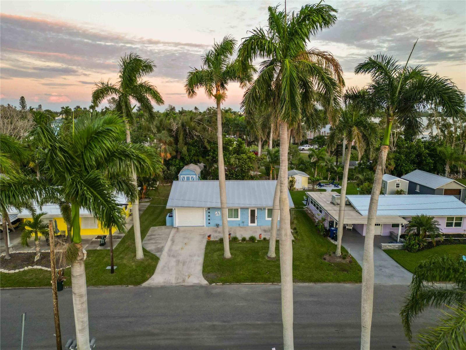 Come see this charming coastal retreat on a colorful Bay-view street near Cortez! This 2-bedroom, 2-bath home offers the perfect blend of comfort, style, and location—just a few short miles from the beach.

Step inside to find tile floors throughout, a newly renovated kitchen, and two fresh, modern bathrooms. The kitchen shines with 42-inch soft-close shaker cabinets, quartz countertops, and plenty of workspace for cooking or entertaining. Both bathrooms feature step-in showers, shaker cabinetry, quartz counters, and ample storage.

With a living room plus a family room, all painted in breezy coastal colors, there’s space to relax and spread out. From several spots in the home—and especially from the large front and rear patios—you’ll enjoy peek-a-boo views of Sarasota Bay. Picture yourself sipping an evening cocktail on the front patio while the sun sets, or strolling down Bayview Drive to take in the sights over Sarasota Bay and Longboat Pass.

Practical updates make this home move-in ready: double-paned impact windows, plantation blinds, ceiling fans, and an HVAC system and water Heater replaced in summer 2025. The metal roof (2012) provides long-lasting durability. An interior laundry and storage room, plus a spacious shed with electricity (contents included), add everyday convenience.
Less then 2 miles from the sandy beaches of Anna Maria Island, beat the traffic or ride your bike! 

Whether you’re looking for a winter getaway, a full-time residence, or an investment property, this home offers it all—steps from the bay and minutes to the beach. Don’t miss this charming retreat!