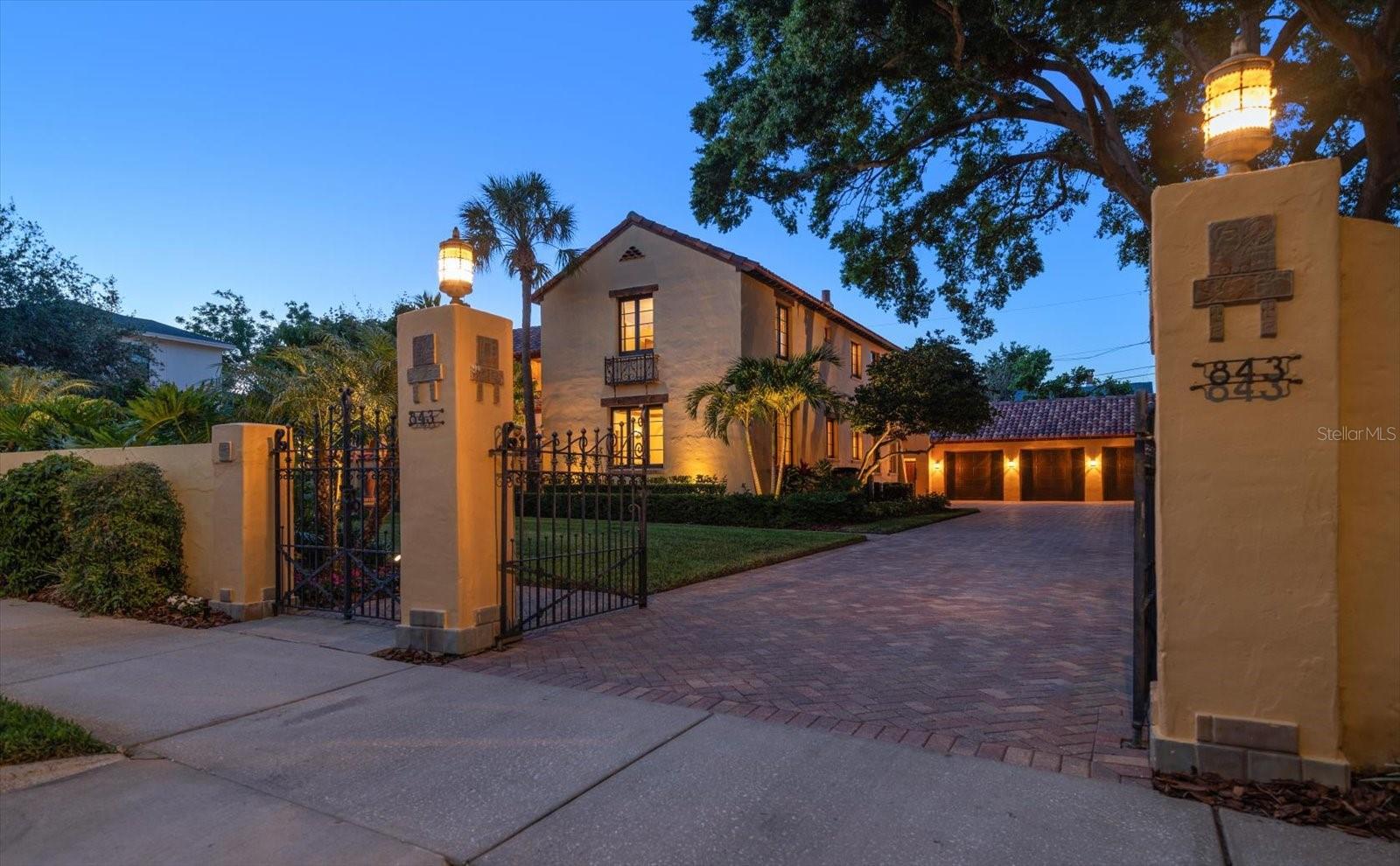 One or more photo(s) has been virtually staged. Step into a piece of St. Petersburg history with this enchanting 1925 Spanish/Mediterranean-style estate, nestled in the highly desirable Crescent Lake neighborhood. Situated on 2½ expansive lots and offering 5,320 square feet of beautifully restored and thoughtfully updated living space, this elegant residence includes a grand main home, guest quarters, a spacious three-car garage, and a lush private pool retreat—all tucked behind a beautifully crafted privacy wall.
Built during the same golden era as the iconic Vinoy Hotel, this architectural masterpiece features a Spanish tile roof, wrought iron balconies, Mayan tile accents, and extensive pecky cypress ceilings and beams. Manicured landscaping, a peaceful courtyard with a Mayan-tiled fountain, and a shaded veranda set the stage for what awaits inside. Every inch of this home reflects the craftsmanship and style of its time—arched doorways, refinished original wood doors, antique hardware, mosaic tile, and period-specific lighting preserve the elegance of the 1920s while seamlessly blending with modern conveniences.
A meticulous renovation in 2008 brought the home into the 21st century without compromising its original soul. Upgrades include new plumbing and wiring, Pella impact windows, and a chef’s kitchen with high-end appliances, custom wood cabinetry, butcher block island, hammered copper sink, and Egyptian marble countertops. Ideal for entertaining, the main living areas flow effortlessly from room to room and open to the private, tranquil courtyard and pool area. The main floor consists of formal dining room, kitchen, informal breakfast room, library, a spacious bedroom with en suite bath and two 1/2 baths.
Upstairs, the luxurious primary suite offers a peaceful escape with a pecky cypress and tile balcony, a spa-like bath with dual copper sinks, soaking tub, oversized shower with rain head and body jets, and a custom dressing room with granite island and extensive storage. Two additional upstairs suites provide private comfort for family or guests.
The detached guest quarters, just steps from the pool and main house, offer two private entrances and include a bedroom, living space, and full bath—all under air-making it ideal for guests or office space. The oversized three-car garage is equipped with hurricane-rated doors, and openers with direct access to the main home via the utility entry. 
Surrounded by flowering gardens, swaying palms, and glowing landscape lighting, the backyard is a true tropical escape. The heated pool, brick paver patio, and outdoor dining areas create the perfect setting for both relaxation and entertaining. This home feels truly enchanting and magical! 
Located just two blocks from Crescent Lake Park and minutes to downtown St. Pete’s shops, restaurants, and waterfront attractions, this home combines the best of historic charm and luxurious modern living—without the need for flood insurance.