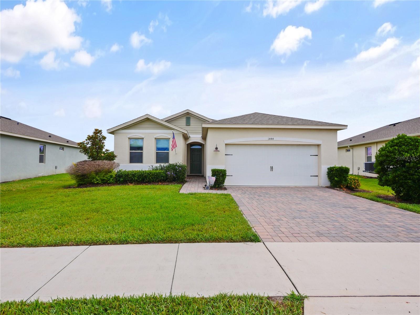 Welcome to 1444 Hopedale Place, a beautifully maintained 3-bedroom, 2-bathroom home in the gated Rosecrest community of Sanford. Situated on an oversized pond-front homesite, this home offers peaceful water views and a low maintenance lifestyle with lawn care, shrub pruning, and irrigation maintained by the HOA.

Inside, you'll find an open-concept floor plan designed for both everyday living and entertaining. The kitchen features quartz countertops, stainless steel appliances, and overlooks the dining and living areas, creating a seamless flow throughout the main living space. Ceramic tile flooring extends through the primary living areas, while 8-foot interior doors add to the home's spacious feel.

The primary suite offers a generous walk-in closet and an en-suite bathroom with dual vanities. Recent upgrades provide added value and peace of mind, including a new HVAC system installed in 2025, a whole-house surge protector, a premium custom shower renovation, ADT security system, fiber-optic internet, smart garage door controls, and smart home technology throughout.

Enjoy relaxing on the covered paver lanai overlooking the pond, where you can take in the natural beauty and wildlife right from your backyard. Located just two doors from the community pool and mailbox, residents also enjoy gated access and a community cabana. Rosecrest offers convenient access to Historic Downtown Sanford, Lake Mary, Orlando Sanford International Airport, Orlando International Airport, major highways, shopping, dining, and everyday conveniences.

If you have been searching for a move-in ready home with water views, modern upgrades, smart home features, and a prime Seminole County location, 1444 Hopedale Place deserves a spot at the top of your list.