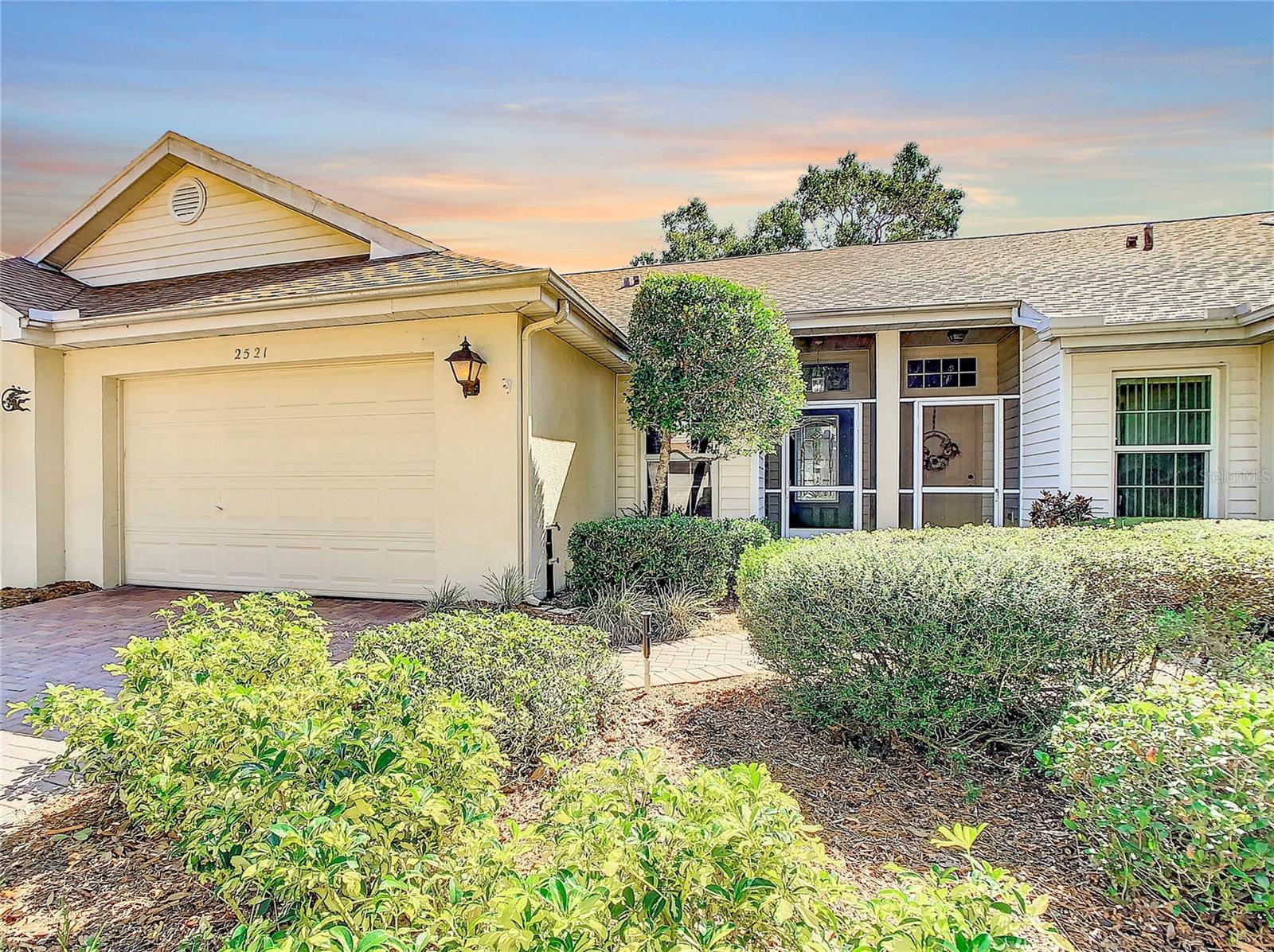 One or more photo(s) has been virtually staged. PRICE ADJUSTMENT! MAINTENANCE FREE 2 Bed/2 Bath/1.5 garage condo with a STUNNING POND VIEW located in the highly desirable gated, active 55+, community of Kings Point!  On arrival this home exudes charming curb appeal, boasting mature landscaping and a paver driveway and walkway.  Be prepared to be amazed as you are greeted with a CAPTIVATING POND VIEW UPON ENTRY! This lovely Concord model provides an airy open concept floorplan accenting vaulted ceilings throughout, and an interconnected kitchen, dining room, living room, and extended Florida/bonus room combo; making it great for entertaining!  The kitchen features a skylight, granite countertop, newer appliances, and a breakfast bar providing ample seating space.  This one level condo has a sizeable owner’s suite privately separated from the second bedroom.  The owner’s suite features an en suite bathroom with a walk-in tiled shower, new glass shower door, and an expensive walk-in closet.  Retreat to the spacious Florida/bonus room to relax, enjoy morning coffee, or watch evening sunsets.  Indoor laundry area with washer and dryer included.  1.5 garage with extra cabinetry and shelving for extra storage, utility sink, and a WATER SOFTNENER SYSTEM. TRANE HVAC 2018, RHEEM WATER HEATER 2018, UPDATED PLUMBING 2019, FRESHLY PAINTED, and NEW TILE FLOORING INSTALLED FOR EASY CARE.  Condo fee includes 24-hour guard gate with security, cable TV, high-speed internet, water, trash, sewer, pest control, exterior and ground maintenance, building insurance, and outstanding amenities. Kings Point is a resort-style, golf cart friendly community including amenities such as an 850-seat Veterans Theater, 2 clubhouses, indoor/outdoor heated pools, hot tubs, spa, golf courses, tennis courts, pickleball, lawn bowling, fitness center, over 200 clubs and activities and so much more! This maintenance-free community is minutes from shopping, hospitals, banking, restaurants and much more. Conveniently located near I-75 providing easy access to Tampa, Sarasota, St Petersburg, airports, theater, and professional sporting events. This property is ready for a new owner to take advantage of all it has to offer!
