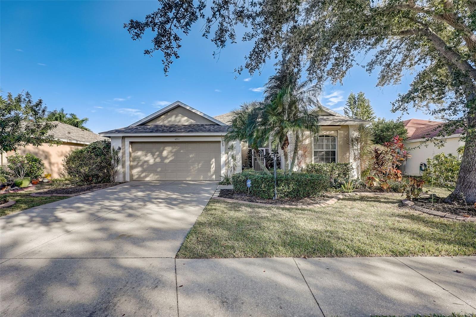 Welcome to your dream home in Carlyle at Villages of Palm-Aire, a highly sought-after community. This 3-bed, 2-bath home features a spacious, thoughtfully designed split floor plan with abundant natural light and serene pond views from the moment you enter. The kitchen offers a spacious amount of counter space and seamlessly connects to the living room, providing a versatile space for dining or entertainment.  The charming breakfast nook is flooded with natural light by the large windows and is inviting for a cozy breakfast.  The owner's suite boasts a walk-in closet, en-suite bathroom with a soaker tub, separate shower and opens to the screened-in-patio. Two secondary guest rooms nestled on the opposite side of the home offer privacy and share the secondary full bath.  Recent updates to home include: 2019 roof replacement, and 2017 A/C. The community offers a heated pool, playground, clubhouse, and access to the Palm Aire Golf and Country Club.  Located near UTC, I-75, restaurants, and more, this home makes daily life easy. Don't miss this exceptional opportunity, contact us for a showing and start living the Sarasota lifestyle you've always dreamed of.