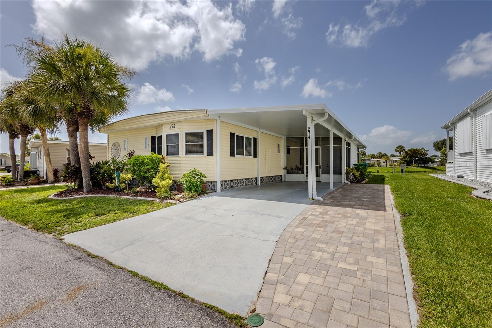LOVE AT FIRST SIGHT! POND VIEWS -2 lLanai's - The moment you step into this breathtaking, pristine 2BR/2BA Jacobsen-built home, you will know you’ve found paradise! Perfectly situated with a sought-after southern rear exposure, this one-of-a-kind property serves up picturesque, serene water views and spectacular Florida sunrises and sunsets. It is the absolute ultimate vibe for pure relaxation!
ABSOLUTE PRIDE OF OWNERSHIP & MOVE-IN READY! Sold FULLY FURNISHED with a gorgeous, high-end coastal look and neutral color palette, this home has been meticulously cared for from top to bottom. Rest easy knowing the heavy lifting has already been done:
Stunning Luxury Vinyl Plank Flooring installed over brand-new plywood subfloors and fully blocked floor joists.
Major Mechanical Updates: Newer Roof (2023), Carport (2023), Storage/Utility Shed (2023), Central A/C (2021), and Water Heater (2016). Newer Windows, bathing the spacious 24'x44' layout in beautiful natural light.open floor plan
INDOOR/OUTDOOR LIVING AT ITS FINEST! Whether you are sipping your morning coffee or hosting evening drinks, your options are endless. Enjoy the tranquil POND VIEWS from the enclosed rear lanai featuring both windows and screens. Step out onto the massive, -screened patio/lanai and 23x10 concrete patio to soak up the sun, or admire the water right from your dining room table!
The beautifully updated kitchen boasts a great layout, while both spacious bedrooms feature large walk-in closets (the guest room even includes a clever built-in desk/office setup!). Both bathrooms feel like a spa, completely modernized with new toilets, fixtures, countertops, stylish bowl sinks, and gorgeous custom tile backsplashes. Outside, the massive 54’ driveway easily accommodates 2–3 cars, plus a spacious 84 sq. ft. utility shed.
Located in the highly desirable Maple Leaf Golf & Country Club—a premier, resident-owned 55+ gated community Award Winning resort-style amenities: an 18-hole golf course, 5 tennis courts, pickleball, bocce ball, lawn bowling, 2 shuffleboard complexes, 2 hot tubs, a state-of-the-art fitness facility, a woodworking shop, a pottery studio, over 75+ active clubs, an on-site restaurant, and a full-service bar! Tiki bar and so much more!
Don't miss this picturesque, immaculate, water-view dream home. Schedule your showing today and start living the dream. Certificate conveys with the sale, furnished,