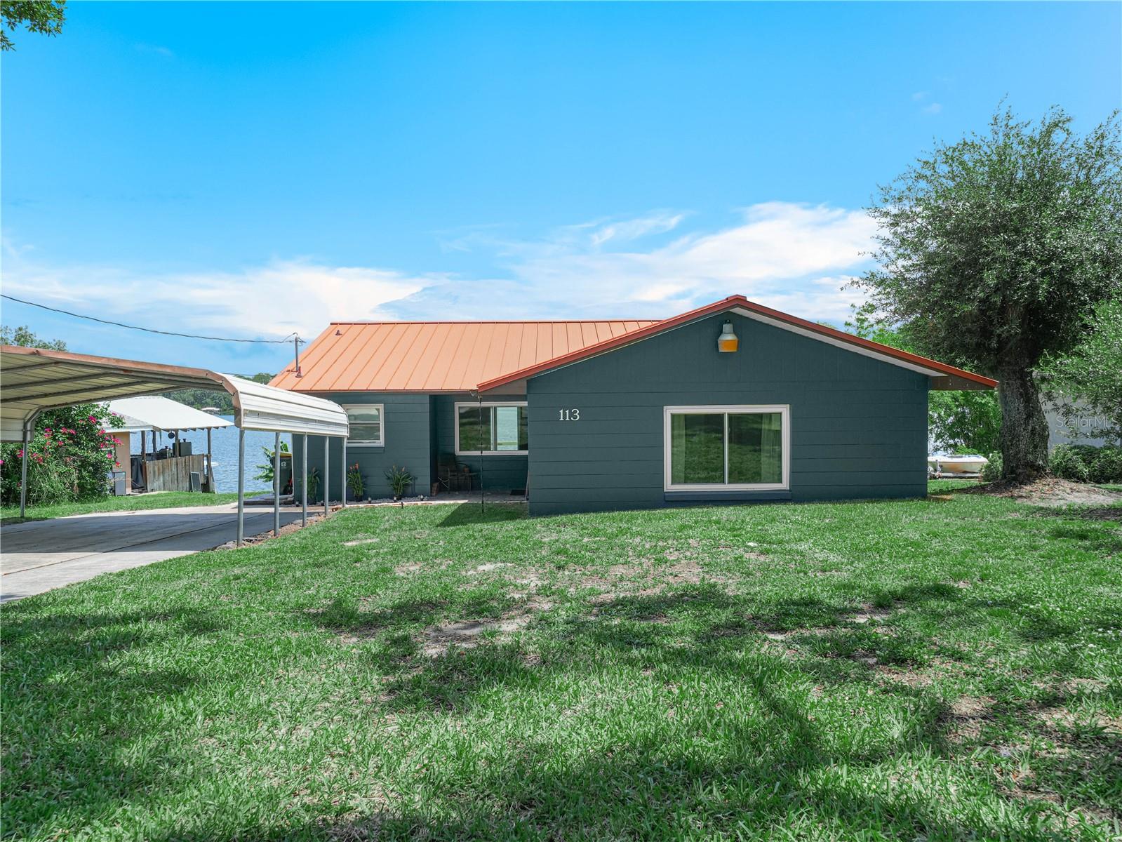 Discover this beautifully updated 3-bedroom, 2-bathroom home, perfectly situated on the shores of a serene spring-fed lake with crystal-clear waters. Enjoy incredible fishing right at your doorstep and take in the stunning views from your own backyard. This property features a spacious 2-car carport for convenience and is conveniently located just a short distance from town, making it an ideal blend of tranquility and accessibility. Updates include: Kitchen, including new Granite countertops, soft close cabinets, ventilation hood, large undermount sink, refrigerator and lighting. Bathroom was completely remodeled as well. Home has all new windows and a brand new 8 ft slider for a gorgeous view of the lake! Central A/c installed 2025. The home was also recently connected to city water! Don’t miss your chance to own this lakeside gem! Agent is related to owner. Property is currently leased, please do not disturb tenants. Listing information is deemed reliable but to be verified by Buyer/Buyer's agent.