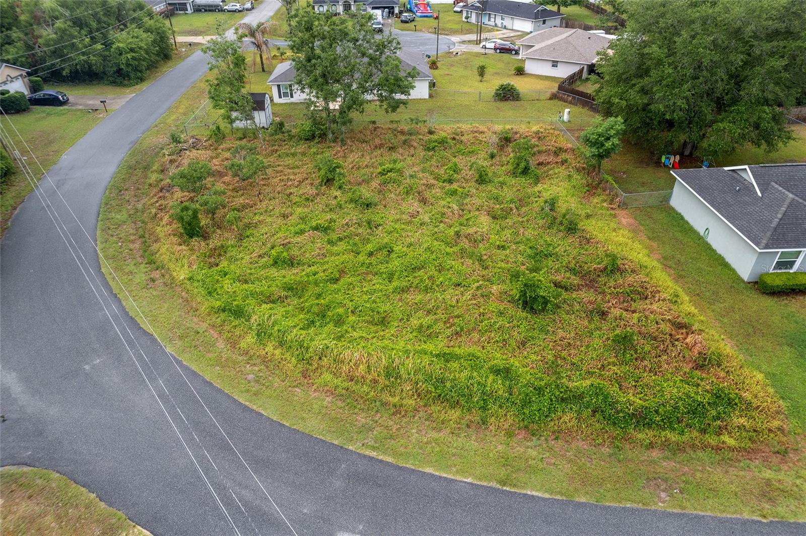 Build your dream home or your next investment property on this cleared 0.28-acre homesite in the well-established community of The Shores in Southeast Ocala. Among mature homes and tree-lined streets, this ready-to-build lot offers a blend of neighborhood charm and everyday convenience. With no HOA, you'll enjoy added flexibility and fewer restrictions. Conveniently near shopping, dining, healthcare facilities, parks, golf courses and the Silver Springs Shores Community Center, this property provides easy access to Silver Springs State Park, downtown Ocala and major roadways while maintaining the comfort and appeal of an established neighborhood. Whether you're looking to build a private residence, seasonal retreat or income-producing investment property, this cleared lot is ready for your vision. Don't miss this opportunity to secure a buildable homesite in one of Southeast Ocala's convenient and established communities!