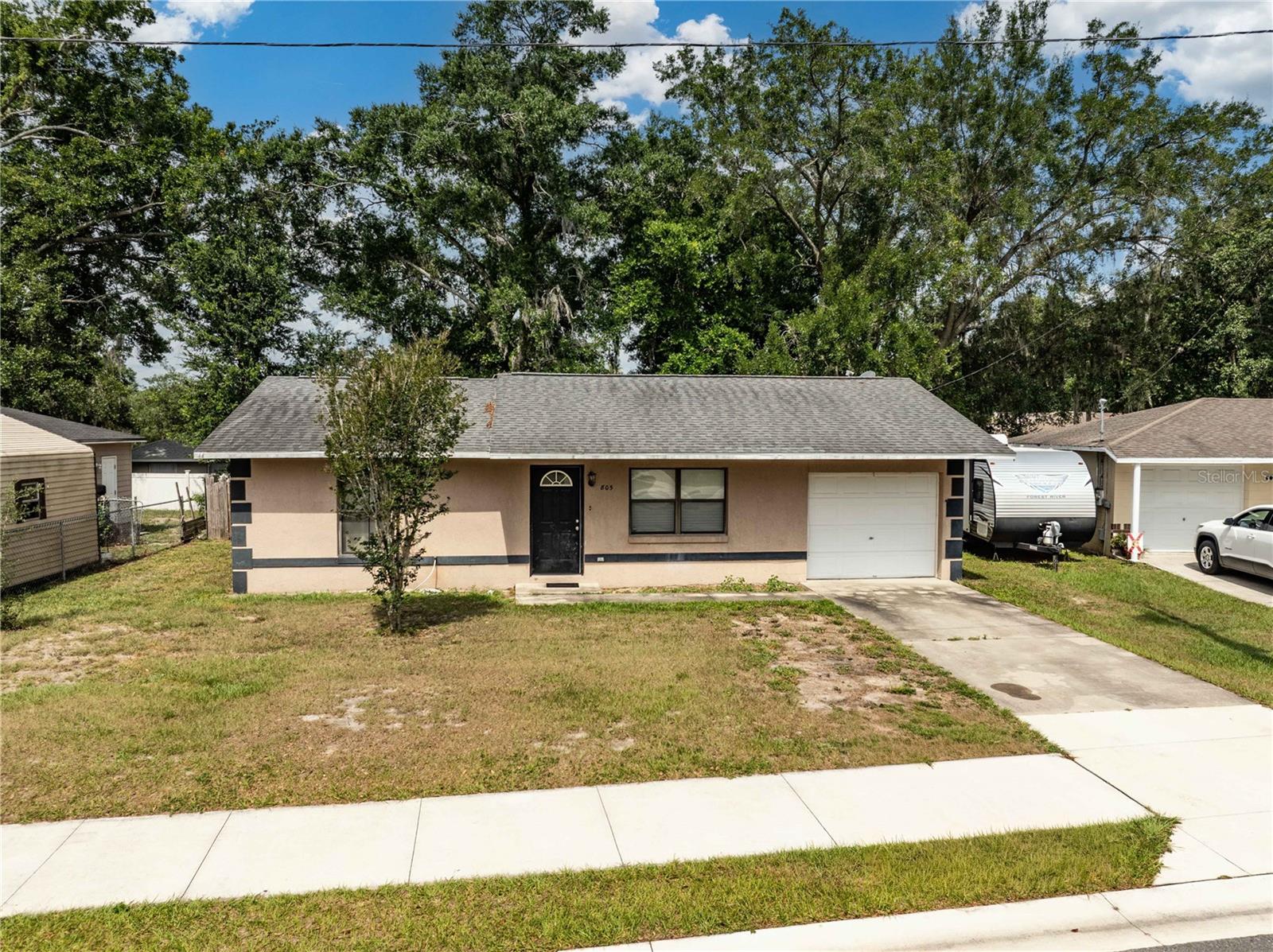 Located just one mile from The Villages, this 2-bedroom, 1-bath home in Wildwood offers a great opportunity for buyers seeking value and flexibility. With a functional layout and solid structure, the property provides a blank canvas ready for your personal touch and updates to match your style and vision.  Whether you’re looking for a primary residence, seasonal home, or investment property, this home presents strong potential to add value over time. The spacious floor plan allows for a variety of renovation possibilities, giving you the freedom to modernize finishes, improve design features, and truly make it your own. Conveniently located near shopping, dining, medical facilities, and all the amenities of the area, this property combines location with opportunity—ready for its next chapter and new vision.