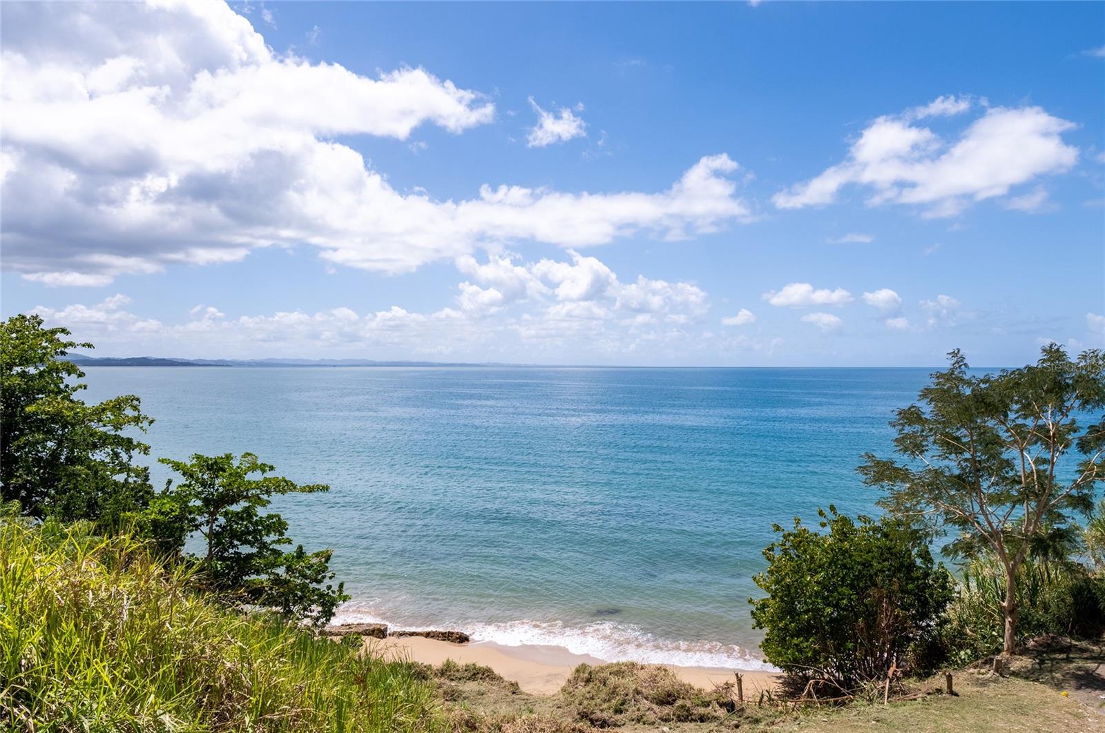 In the heart of Puerto Rico’s west coast, where the sea meets one of the island's most coveted landscapes, lies a truly exceptional opportunity: 24,254 square meters of direct oceanfront land, located in Bo. Caguabo, along Highway 115 between Añasco and Rincón, adjacent to the renowned Rincón Beach Resort.

Property Highlights
This land offers an experience that is difficult to replicate in today's market: a completely unobstructed view of the Caribbean Sea with full western exposure, guaranteeing uninterrupted ocean sunsets. The topography and positioning of the lot allow for a direct connection to the shoreline, creating an ideal setting for either private use or hospitality development.

The property is equipped with key elements for immediate activation: Water and electricity infrastructure available; Surveys and segregation completed; Two fully equipped, operational modular residences: 2 bedrooms, 1 bathroom, kitchen, and living area; Independent studio with a private bathroom.

This existing component allows for income generation from day one while future expansion is planned.

Strategic Potential
From a strategic perspective, this asset is positioned as an ideal platform for: Development of a high-end modular unit project; Boutique Short-Term Rental (STR) concept; Private retreat or legacy beachfront estate.

A Rare Opportunity
In a market where the availability of beachfront land is increasingly limited, this property stands out as a singular piece of real estate: an expansive, usable coastal strip with basic infrastructure in a location that combines accessibility, exclusivity, and proven tourism value.

One of the last direct coastal opportunities in this region of Western Puerto Rico.
