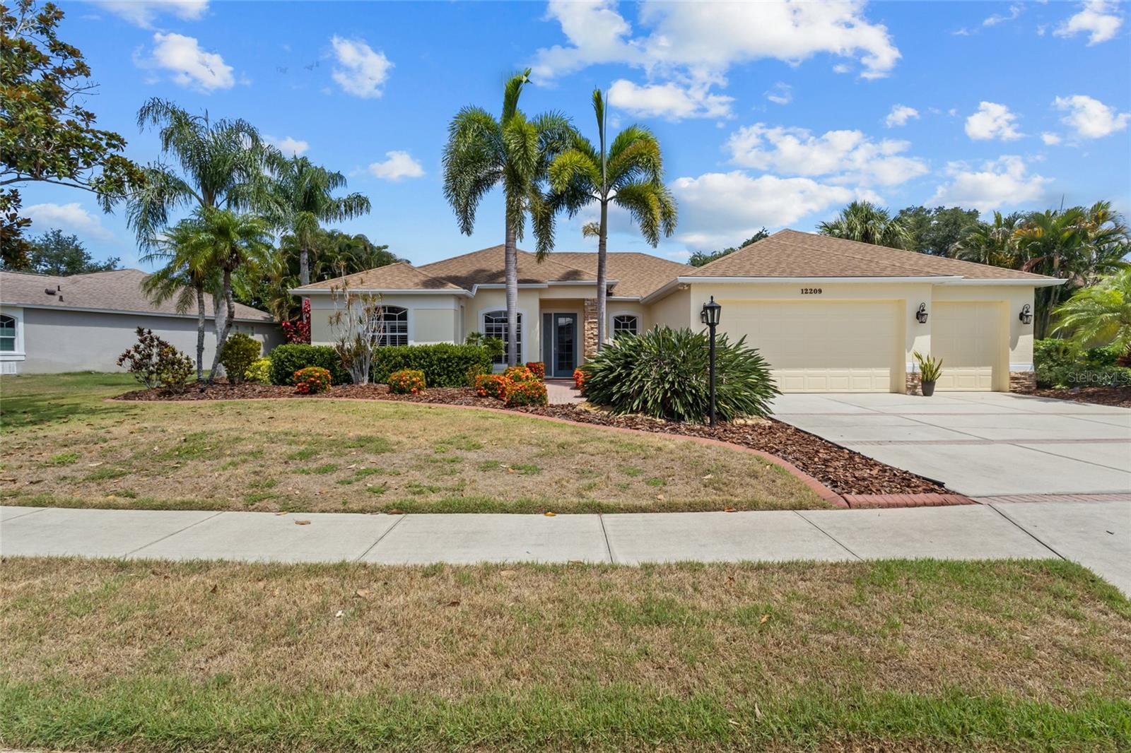 You’ll love living in the award-winning community of Summerfield Village in Lakewood Ranch. Ideally located, this home is just minutes from schools, shopping, Main Street Lakewood Ranch, sports fields, the YMCA, and more. It sits on a peaceful lakefront lot, offering tranquil views in a beautifully landscaped setting with a welcoming front entrance.

Inside, you’ll find a spacious, thoughtfully designed four-bedroom home with a den/office and three baths, built by Lee Wetherington. The open split floor plan features warm colors and an easy flow throughout. The home also includes custom built-in closets, central vacuum, an electric car charger, a roof installed in 2018, and an air conditioner replaced in 2022. The screened lanai is perfect for year-round enjoyment, with plenty of space to relax, entertain, or spend sunny afternoons by the sparkling custom pool.

The open kitchen overlooks the family room and includes a breakfast bar and an aquarium-window dinette area with scenic views of the lanai, pool, and lake. Additional features include tray ceilings, crown molding, Hunter Douglas window and sliding glass door treatments, plantation shutters, and other high-end finishes.

The primary suite is a true retreat, set apart from the secondary bedrooms and complete with a spa-like bath featuring a walk-in shower, soaking tub, dual sinks, and dual walk-in closets. A spacious three-car garage provides ample room for vehicles, storage, and hobbies. With top-rated schools, dining, parks, shopping, and recreation nearby, this home offers not just a place to live, but a lifestyle of comfort, convenience, and relaxation.