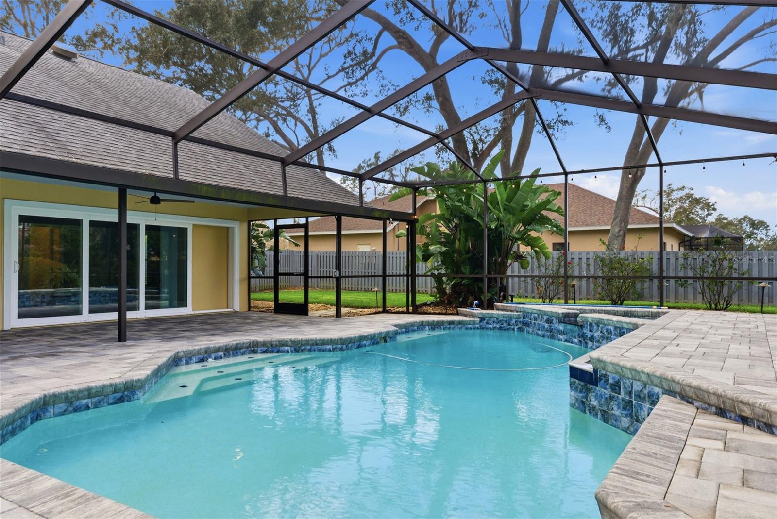 Some photos virtually staged. Recently repositioned to reflect today’s market, this ½-acre pool home in the established Sugarloaf Ridge community presents a rare opportunity to own space, privacy, and an entertainer’s layout in a neighborhood where homes seldom become available.
Set within an intimate 18-home double cul-de-sac with low HOA and no CDD, the property offers a setting that is increasingly hard to find—mature surroundings, larger homesites, and a true sense of residential permanence.
Designed with gathering in mind, the home features multiple living and flex spaces, including a dedicated game room with custom built-in bar and beverage cooler, an upstairs loft ideal for media, work, or play, and a layout that allows everyone room to spread out. The main living areas flow to a screened lanai and saltwater pool, creating a seamless indoor-outdoor connection ideal for entertaining.
The backyard is a standout feature, offering a fully fenced yard with green space for play, pets, or future enhancements, along with a private pool and spa—delivering the kind of Florida lifestyle many buyers are seeking but rarely find in combination with this level of space.
With 4 bedrooms, 3.5 baths, and a 3-car garage, the home provides both functionality and flexibility for a variety of living needs. Key system updates include roof replacement (2018), solar (owned), updated pool components and enclosure (2022), and multiple HVAC units replaced between 2020–2022.
For buyers willing to recognize potential and prioritize location, lot, and lifestyle, this home offers a compelling opportunity to create something truly special in one of Valrico’s most established and desirable communities.
