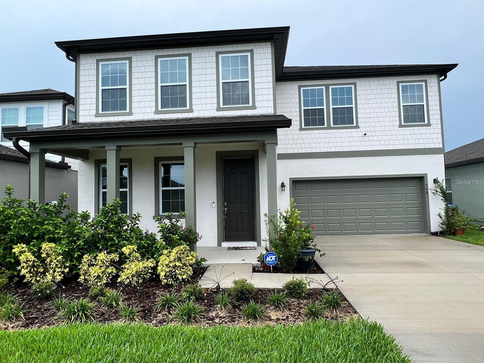 Sunbrooke community rental opportunity. This single-family residence features 4 bedrooms, 3.5 bathrooms, and over 3,080 square feet of living space. Designed with energy efficiency in mind, the property comes equipped with an 11kW solar panel system, double-pane windows, and insulated construction to help manage monthly utility costs. Complete lawn care and mowing services are included in the rent. The two-car garage features a dedicated 240V electric vehicle charging outlet, and a whole-house water softener system is already installed. The interior features an open-concept layout with rich wood cabinetry, stainless steel appliances, and updated lighting fixtures. The primary suite includes custom window treatments and a frameless glass shower enclosure. Outdoor living features a rear view facing a local tree farm. Residents enjoy access to the nearby community pool and cabana. Located with convenient access to the Narcoossee corridor, local shopping, dining, and the Lake Nona area. Tenants are responsible for water, trash, and the remaining electric bill not covered by the solar panels.