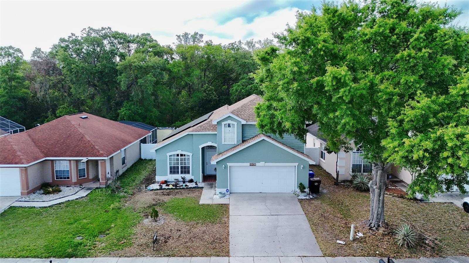 Virtually Staged. Virtually Staged. Welcome to the heart of Kissimmee living! This stunning 5-bedroom pool home offers the perfect blend of comfort, functionality, lifestyle, and long-term value. Featuring 2 bedrooms on the first floor, including the spacious primary suite, this property is ideal for multigenerational living, a primary residence, vacation home, or savvy investors seeking a prime Central Florida opportunity. Designed with an open-concept layout, the home showcases laminate and ceramic flooring throughout with NO carpet, creating a modern and low-maintenance living environment. Step outside to your private screened pool and backyard retreat overlooking a peaceful conservation area with NO rear neighbors the perfect setting to relax and enjoy Florida living year-round. A standout feature of this property is the FULLY PAID solar panel system, which will transfer to the new owner at closing. According to the seller, recent electric bills have averaged approximately $60/month, offering exceptional energy efficiency and potential long-term utility savings a rare advantage in today’s market. Located just minutes from US192, shopping, restaurants, entertainment, and Central Florida’s world-famous attractions, this property is perfectly positioned for convenience, lifestyle, and accessibility. Whether you're looking to elevate your everyday living experience or secure a high-demand property near Kissimmee’s vibrant growth corridor, this home delivers exceptional versatility and value. Schedule your private showing today and experience the lifestyle, location, and savings this unique property.