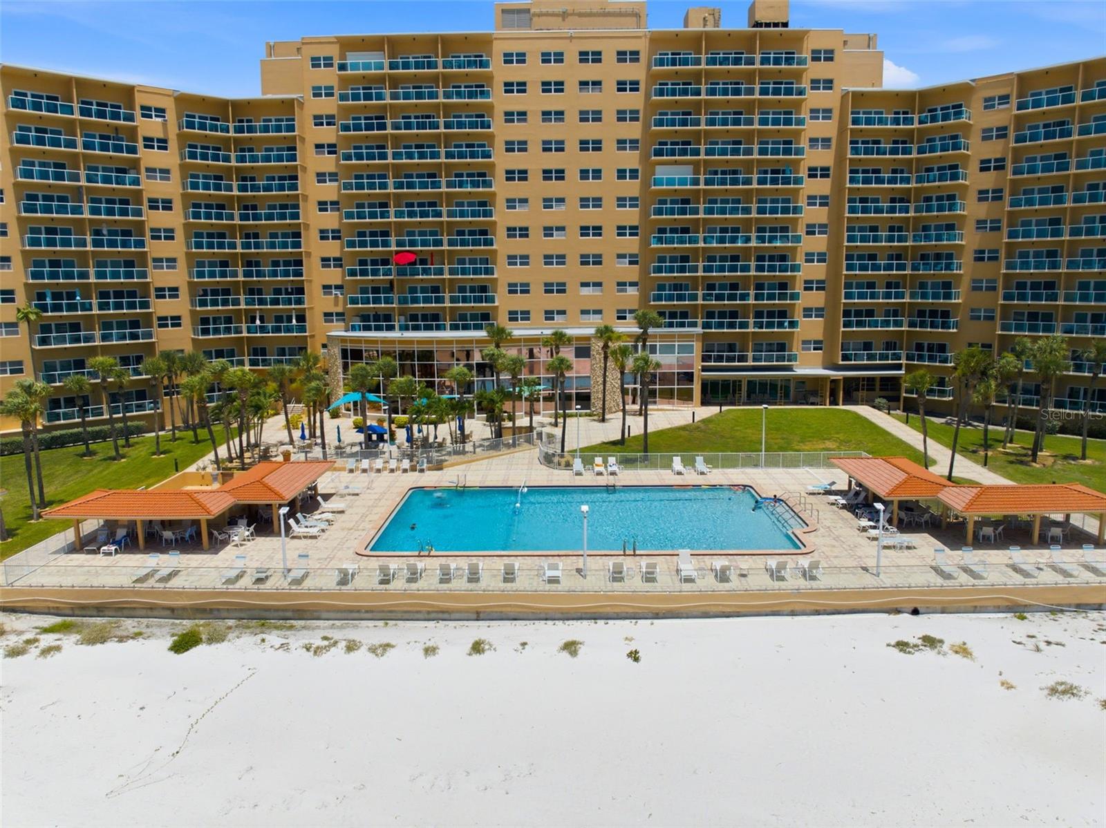 Virtually Staged. BEACHFRONT LIVING AT ITS BEST Welcome to Regatta Beach Club, a rare opportunity to own a spacious two-bedroom, two-bath residence located directly on the world-famous sugar sands of Clearwater Beach. Positioned on the 12th floor, this residence offers sweeping views of the Intracoastal Waterway, sparkling city lights, and breathtaking Florida sunsets. Just steps from your door, enjoy direct access to one of the most celebrated beaches in the country. Regatta Beach Club is one of Clearwater Beach's most sought-after waterfront communities, offering residents a true resort-style experience with exceptional amenities, including: Gulf-front heated swimming pool, full fitness center, social room, and game room (pool table, table tennis), 13-seat private movie theater, community room with full kitchen, Bicycle and kayak storage, workshop, EV charging stations and car wash bay, outdoor grilling and picnic areas, 24-hour security, daily grounds maintenance, ample parking, beach trolley stop directly in front of the property. This residence has been freshly painted and offers a unique opportunity for a new owner to personalize and complete select finishing touches to their own taste and style. With its elevated location, spacious layout, and unbeatable beachfront setting, this property presents exceptional value within one of Clearwater Beach's premier communities. Imagine starting each morning with a walk along the beach, spending afternoons by the Gulf-front pool, and ending the day with stunning sunset skies and waterfront views from your own private retreat. Unit C1214 offers more than a home—it offers the Clearwater Beach lifestyle.