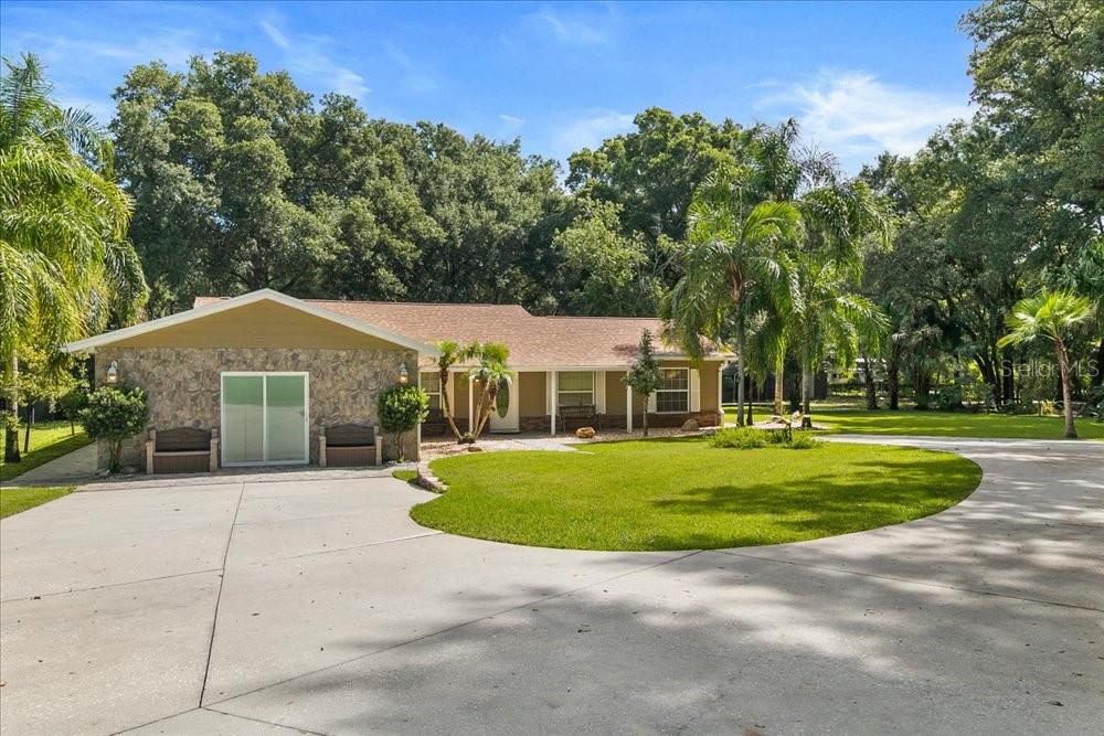 Discover the perfect blend of PRIVACY, ACREAGE AND ENDLESS possibilities offering the ideal setting for MULTI-GENERATIONAL LIVING, FARMING, RECREATION, OR creating you own PRIVATE RETREAT on 2.5 ACRES in the heart of Apopka. This spacious residence features 4 bedrooms, 4 bathrooms, and a sparkling SCREENED-IN POOL,  offering an exceptional lifestyle for those seeking room to LIVE, GROW AND CREATE. Designed for both comfort and functionality, the home boasts an inviting OPEN-CONCEPT FLOOR PLAN, spacious living areas, and thoughtfully designed rooms that accommodate today’s lifestyle needs. A versatile front room can easily serve as a home OFFICE, GYM, STUDY OR PLAYROOM. The PRIMARY SUITE offers a private retreat with an EN-SUITE BATHROOM, while the home’s numerous upgrades provide peace of mind, including NEW WINDOWS, a NEW ROOF  installed in October 2025, a NEW AC UNIT in 2026, a NEW WATER HEATER, and a recently CLEANED AND SERVICED SEPTIC SYSTEM. SOLAR HEATING PANELS further enhance efficiency and convenience. Step outside and embrace the possibilities. The property is fully equipped for outdoor living and recreation, featuring an automatic GATED ENTRANCE, PRIVATE DRIVEWAY, covered lanai, OUTDOOR BATHROOM, RV and boat parking, and ample space for MULTIGENERATIONAL LIVING. Surrounded by mature landscaping and FRUIT TREES, including AVOCADO, MANGO, AND LIME TREES, this estate offers a true farm lifestyle. With NO HOA restrictions, this extraordinary property presents endless opportunities to expand and customize. Create your dream estate, add horse stables, establish a hobby farm, cultivate gardens, develop a commercial nursery, or explore future parcel opportunities. Rarely does a property offer this level of privacy, versatility, and potential, all while being conveniently located near shopping, dining, major highways, and Central Florida attractions. Come experience your own paradise and imagine the possibilities. CALL TODAY AND SCHEDULE YOU PRIVATE SHOWING!