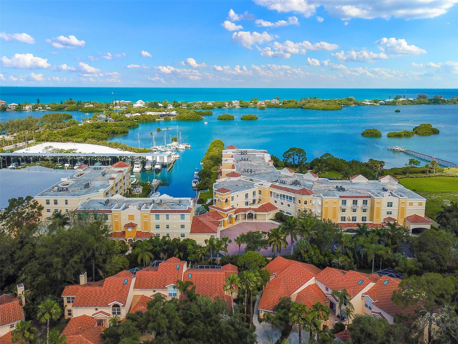 Waterfront Sanctuary-Boater's Paradise at the Osprey Harbor Village-
3 Bedrooms | 2 Bathrooms | Direct Intracoastal Frontage
Rare opportunity for direct Intracoastal living at Villas at Osprey Harbor Village (formerly Bellagio Harbor Village). This 3 bedroom, 2 bath residence offers approximately 1,862 sq. ft. of light filled living space with views of the canal, Little Sarasota Bay and Intracoastal Waterway. The open concept design features 9’5” tray ceilings, impact windows and doors, and solid wood cabinetry, granite countertops, kitchen island, and kitchen island bar—ideal for entertaining, anchored by a neutral, airy palette with timeless finishes. The split bedroom layout provides privacy, with a spacious primary suite featuring a spa style bath, separate tub and shower, and direct access to an oversized 270 sq. ft. waterfront balcony from the bedroom.  Each window is a curated lens, framing the hues of the Bay and the sculptural silhouettes of architectural lines of Mediterranean inspired Villas. Days here are defined by the rhythmic play of light reflecting across the water and the silent flight of ospreys, eagles, and pelicans—a true haven for the bird watcher seeking a quiet refuge. Whether you are hosting a sunset gathering on your private balcony or entertaining your guests at the community terrace, the club room or embarking on a day of boat excursion to the newly opened Midnight Pass, the lifestyle here is one of effortless coastal elegance. Community amenities include a deep water harbor marina with wet and dry slips, resort pool, clubhouse, fitness center, hot tubs, kayak storage, and launch. Centrally located between Sarasota and Venice, and minutes from Venice, Nokomis, Siesta Key, and Casey Key, Oscar Scherer State Park, Spanish Point, Legacy Trail, and cultural and retail amenities of Sarasota. With new metal roof, exterior and interior paint completed in 2025, this property stands as a resilient sanctuary of enduring value. For the resident who values privacy, prestige, and the restorative power of nature, this is the definitive Osprey address. Schedule your private tour today.