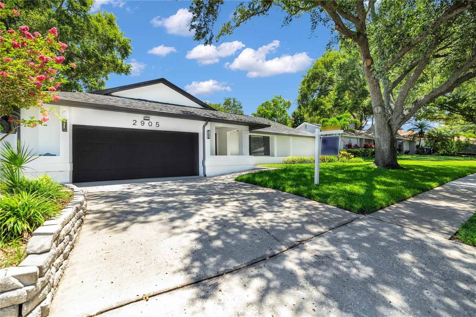 PRICE IMPROVEMENT ON THIS beautiful home  located in a highly desirable neighborhood THE BLUFFS. Situated in a high and dry, non-flood - non evacuation zone, within short distance to beautiful Pinellas County Beaches, The Bluffs shopping Plaza, Parks and recreation centers. As of recent the neighborhood has had renovations to include newly paved streets and updated sidewalks for your convenience. Low annual fee covers maintenance surrounding the exterior of subdivision to include the 2 entrances. 
This 3-bedroom 2-bathroom Pool home has been updated to perfection. Once you walk in through the front door, you will be invited by the open floorplan of this home. It is bright and full of natural light coming from 2 large sliding glass doors, and oversize windows on Living and dining room. This area can accommodate large family gatherings with ease. Beautiful, remodeled kitchen is a Chefs dream come true. White-Shaker Wood cabinets with soft close hardware, and new LG appliances, High end countertops and backsplash, and not to forget a Large Island with waterfall quartz. Split floor plan, with large master on one side, featuring Sliding glass door to pool deck, walk-in closet, and newly remodeled bathroom with Walk-in Shower. On the other side there are two bedrooms as well as guest bathroom that's completely remodeled as well. Inside laundry room is spacious, comes with all new cabinetry, quartz countertops, beautiful backsplash, large Sink as well as New LG washer and Dryer. All new doors, ceiling and wall texture, light fixtures, modern baseboards, hardware, window blinds and Luxury Vinyl flooring. There are 3 large sliding glass doors that lead to the newly paved pool deck. In-ground pool has been updated as well with all new coping, luxury waterline tile, Diamond white pebble sheen finish, updated plumbing and Salt Chlorinator for easy maintenance. Moving on into the garage, it comes complete with new hurricane rated door, new opener and brand-new EPOXY FLOORING. Also new is the 3-dimmensional Shingle Roof, AC unit, added attic insulation, water heater replaced in 2024, paved walkway as well as new vinyl fencing for your privacy.  House has been freshly painted inside and out, yard received a complete clean out with trimmed trees, shrubbery and new sod. Properties in this neighborhood are hard to come by.  This is a must see, call today to schedule your showing before is too late