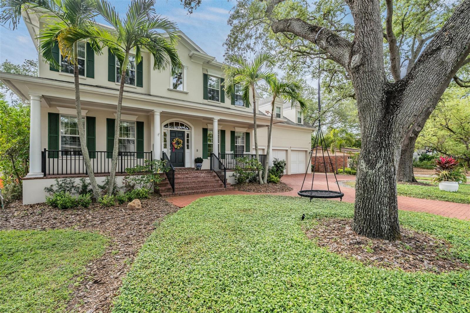 Nestled on a generous lot with a brick paved circular driveway and a 3-car garage, this 4,643 sq. ft., 5-bedroom, office/den, 4.5-bathroom custom-built home on sought-after Davis Islands. As you step inside, you'll be captivated by the refined elegance of hardwood flooring, crown molding, and a formal dining room accented with chair railing.

The gourmet kitchen boasts a 6-burner Viking gas range, two Viking double convection ovens, built-in microwave, quartz countertops, and a subzero side-by-side refrigerator. The butler's pantry, complete with a wine fridge and two walk-in pantries, offers ample storage. Designed for entertaining, the kitchen seamlessly connects to the family room, which features a cozy fireplace and French doors that open onto a brick paver-covered porch.

The main level also includes a sophisticated office with French doors, a charming library area with floor-to-ceiling custom bookshelves, and a versatile mudroom, perfect for pet owners or hobbyists. Upstairs, the master retreat offers a sitting area, two walk-in closets, and a luxurious bathroom with dual vanities, a walk-in shower, and a soaking tub. The second bedroom has an en suite bathroom and walk-in closet, while bedrooms three and four share a Jack & Jill bathroom with dual vanities, a private shower/bath, and walk-in closets.

The impressive fifth bedroom doubles as a bonus room with a custom barn door entry, en suite bathroom, and expansive private living space. Rounding out the upper level is a convenient laundry room, located near all bedrooms. **Home was revamped/redone in 2019 upstairs, downstairs, inside, and outside... MORE RECENT ADDITIONS: BRAND NEW ROOF, WHOLE HOUSE GAS GENERATOR AND NEWER AC SYSTEMS**
