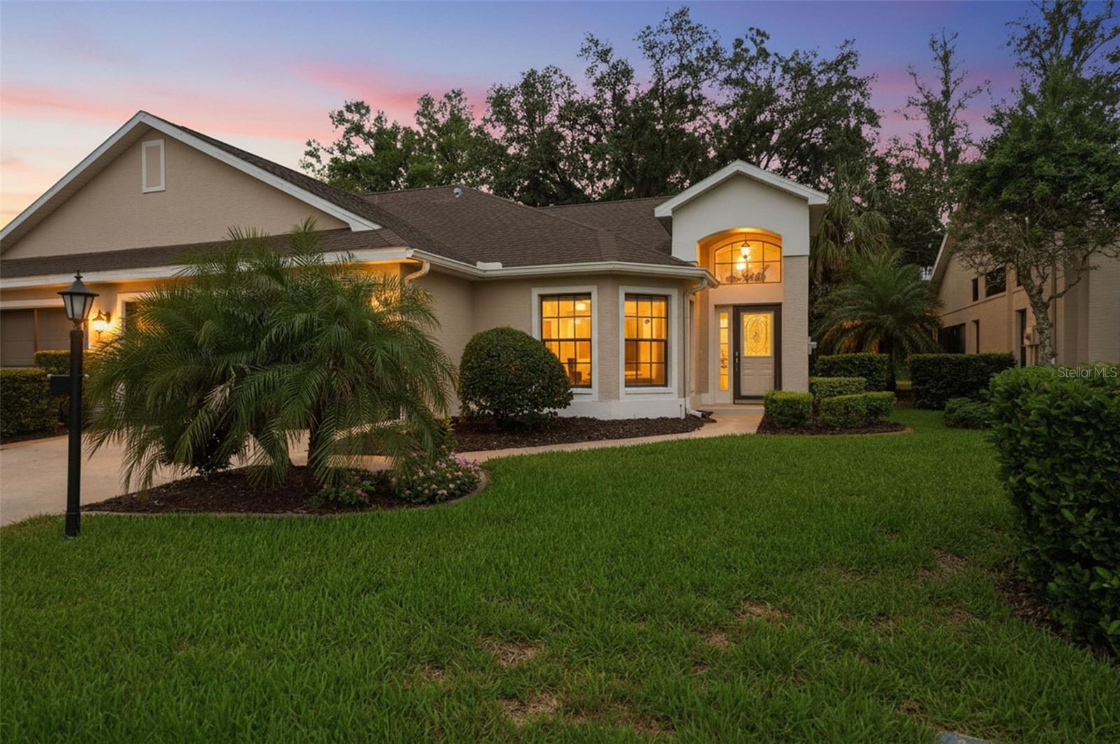 Enjoy maintenance-free living with stunning golf course views in this 2-bedroom villa located in the highly desirable 55+ community of Timber Greens. Overlooking the 2nd tee box, this move-in-ready home combines updated interiors, energy-efficient improvements, and resort-style amenities in one exceptional package.

Inside, the spacious eat-in kitchen features upgraded wood cabinetry, granite countertops, a pantry, and vaulted ceilings that enhance the open feel of the home. Recent updates include wood-look tile plank flooring throughout the main living areas, kitchen, and primary suite, along with fresh interior paint. The primary suite offers two closets and an en-suite bath with a walk-in shower and ample counter space. A large living room with vaulted ceilings provides plenty of space for relaxing or entertaining, while the indoor laundry room adds everyday convenience. Additional upgrades include a new HVAC system, new attic insulation, and impact windows already installed in many rooms, with additional impact windows scheduled for completion.

Step into the expansive Florida room and take in peaceful golf course views, creating the perfect space for morning coffee, reading, or gathering with friends. The maintenance-free lifestyle allows more time to enjoy everything this vibrant community has to offer.

Timber Greens residents enjoy access to an 18-hole golf course, clubhouse, restaurant and 19th Hole lounge, resort-style pool, fitness center, pickleball and tennis courts, putting green, shuffleboard, library, arts and crafts activities, and a full calendar of clubs and social events. HOA fees include cable, internet, and lawn maintenance for added value and convenience.

Offering scenic views, thoughtful updates, and an active resort-style lifestyle, this golf course villa is an outstanding opportunity to enjoy the best of Timber Greens living.