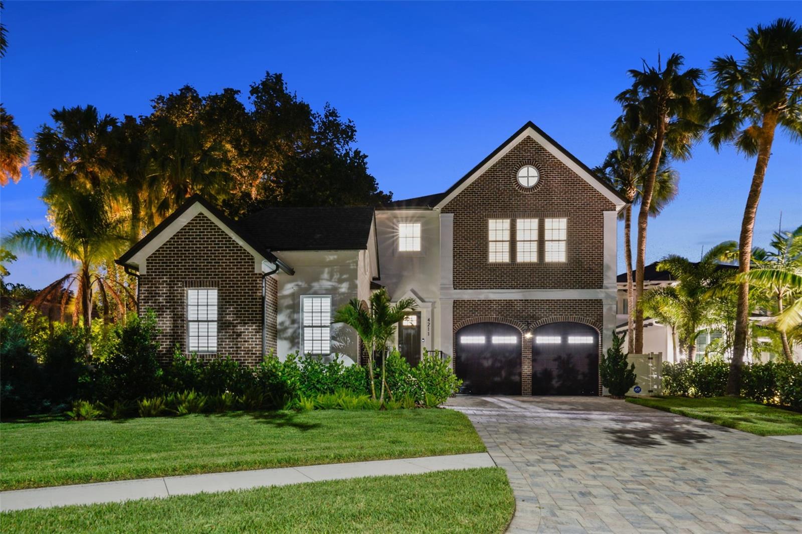 Experience Charleston charm in this beautifully designed home built in 2023, featuring a breezeway entry and side porch that welcome you into a stunning foyer and open floor
plan. With 10' ceilings, hurricane impact windows, custom woodworking, and smooth drywall throughout, the craftsmanship is impeccable. The main level boasts a formal
dining room, an antique wine room, a built-in elevator shaft, a mudroom, and a detached guest suite perfect for use as a gym. Enjoy outdoor living on the expansive paved
lanai with a built-in outdoor kitchen.
The breathtaking kitchen is equipped with custom cabinetry, Wolf and SubZero appliances, a wine fridge, and an impressive butler’s pantry. Upstairs, a spacious loft with
custom built-ins leads to a luxurious master retreat featuring two large walk-in closets and a stunning master bathroom with separate vanities and a spacious wet room with a
free-standing tub and shower. Four additional upstairs bedrooms each have private ensuite bathrooms. Convenient upstairs laundry room.
The backyard is lushly landscaped, offering privacy from neighbors. The Three-car garage features epoxy floors. The home is pre-wired for smart home technology, audio, and
cameras, and includes a Whole-House Generator and Automatic Shades for added convenience.
Ideally located, this home is less than 3 miles from both the International Airport and International Plaza, and just 5 miles from Downtown Tampa.
