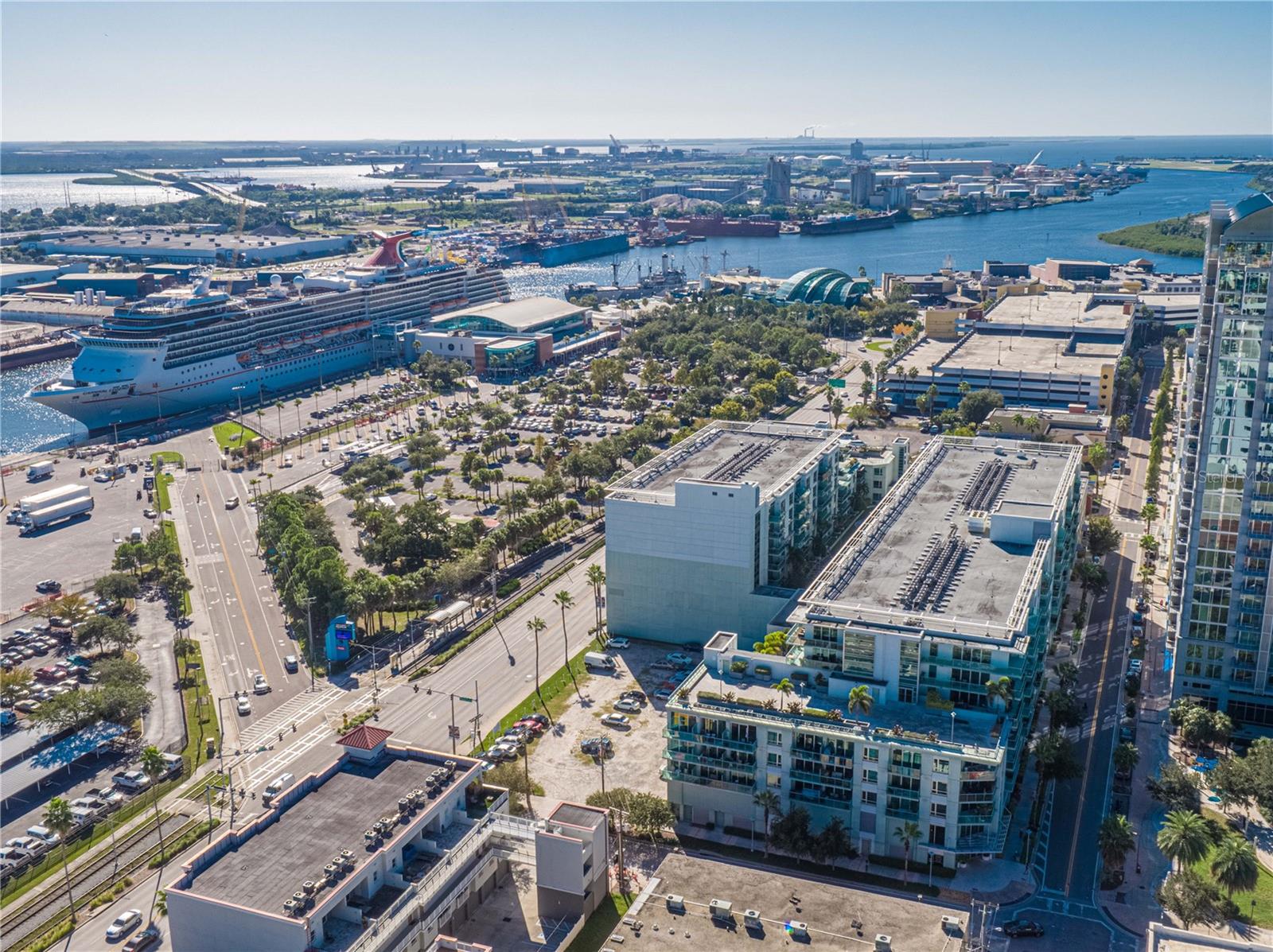 Experience vibrant urban living in this beautiful 2-bed, 2-bath mid-rise condo in the heart of Channelside. The kitchen features an oversized island, granite countertops, stainless steel appliances, and new wine fridge. The primary suite offers a large walk-in closet, dual sinks, soaking tub, stand-up shower with new glass shower enclosure. The second bedroom is located in the front of the unit and features a double door closet, making it ideal for guests, a home office, or an additional living space with its own private bathroom. The unit has built-in speakers throughout the home and new HVAC (2023). The building offers resort-style amenities, including a clubhouse, pool, hot tub, gym, and sauna. It is located near Water Street Tampa, USF Morsani College of Medicine, Sparkman Wharf, and Publix. Conveniently situated right at the historic trolley stop connecting you to downtown and lively Ybor City. Also right by the highly anticipated GasWorx. The condo includes one private garage-locked parking spot and the option for two free city parking residential permits on 12th St—a feature not available to residents of building two.
The HOA fee includes cable and wireless internet, building and flood insurance, roof, pool and grounds maintenance, building maintenance, 7-day front desk staff, an on-site manager, and management office services. Don’t miss your chance to own this move-in ready condo in one of Tampa’s most desirable and fast developing neighborhoods — schedule your showing today!