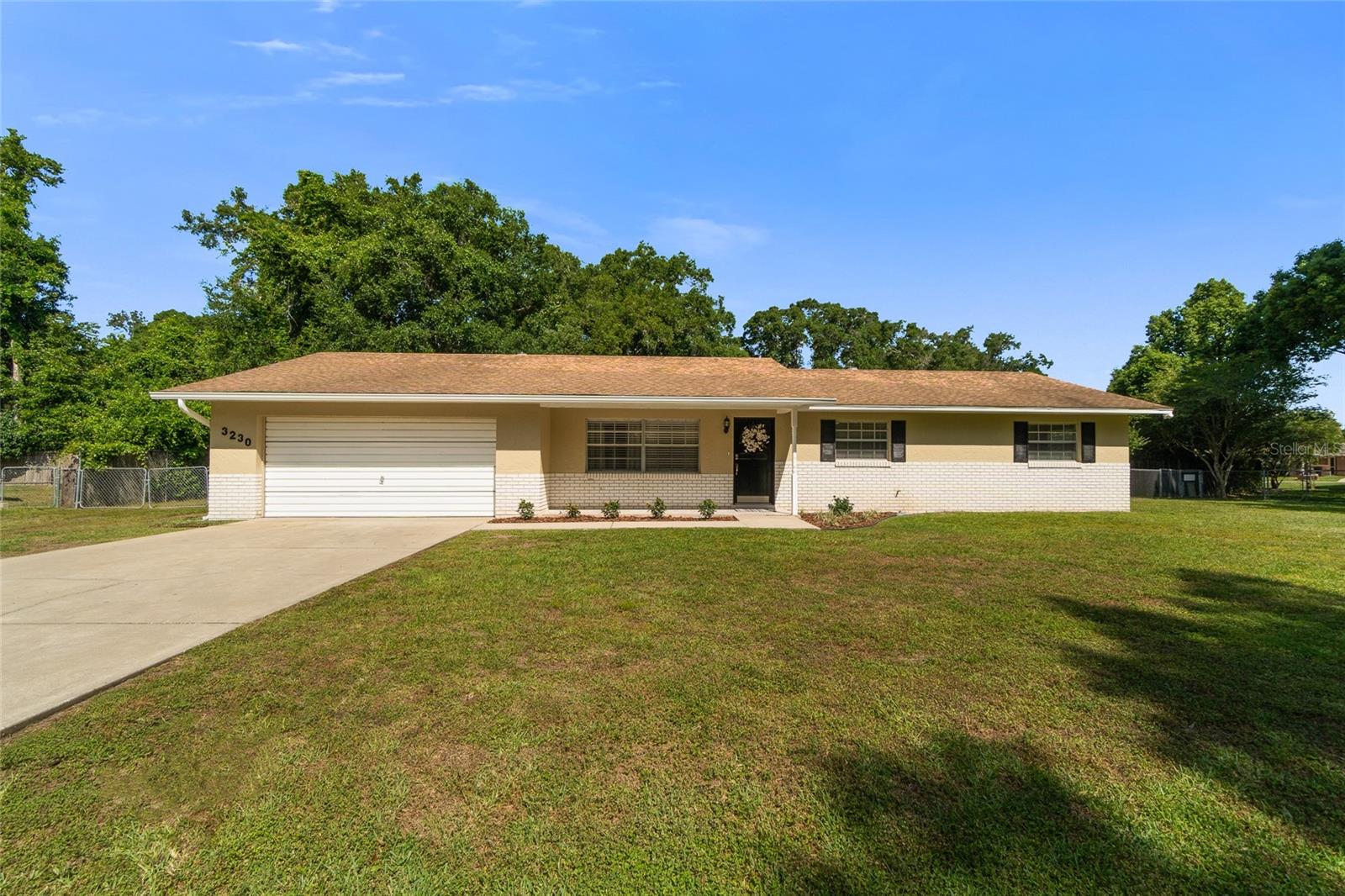 Recently Remodeled & Move-in Ready! This must-see spacious SE Ocala home includes 3 bedrooms, plus a large Den/Office, 2 Bathrooms, a Huge Family Room, Dining Room, Inside Laundry, and a Beautiful Kitchen!  The home is located on one of the largest lots in the subdivision at .40 acres and is minutes from everything!  The list of upgrades includes new Luxury Vinyl Plank flooring in the dining room, bedrooms, and office/den, recently painted inside and out, new ceiling fans throughout, 4" baseboards, USB outlet in each room, electronic front lock, and much more. The stunning kitchen includes a full stainless appliance package, solid wood cabinetry, white subway tile backsplash, and granite countertops with a large single sink basin. The home also has inside laundry with included washer/dryer, a fully finished garage, a large 12x29 rear patio, and a spacious fenced-in backyard. No HOA dues! Property shows like a model. It can even be purchased fully furnished!