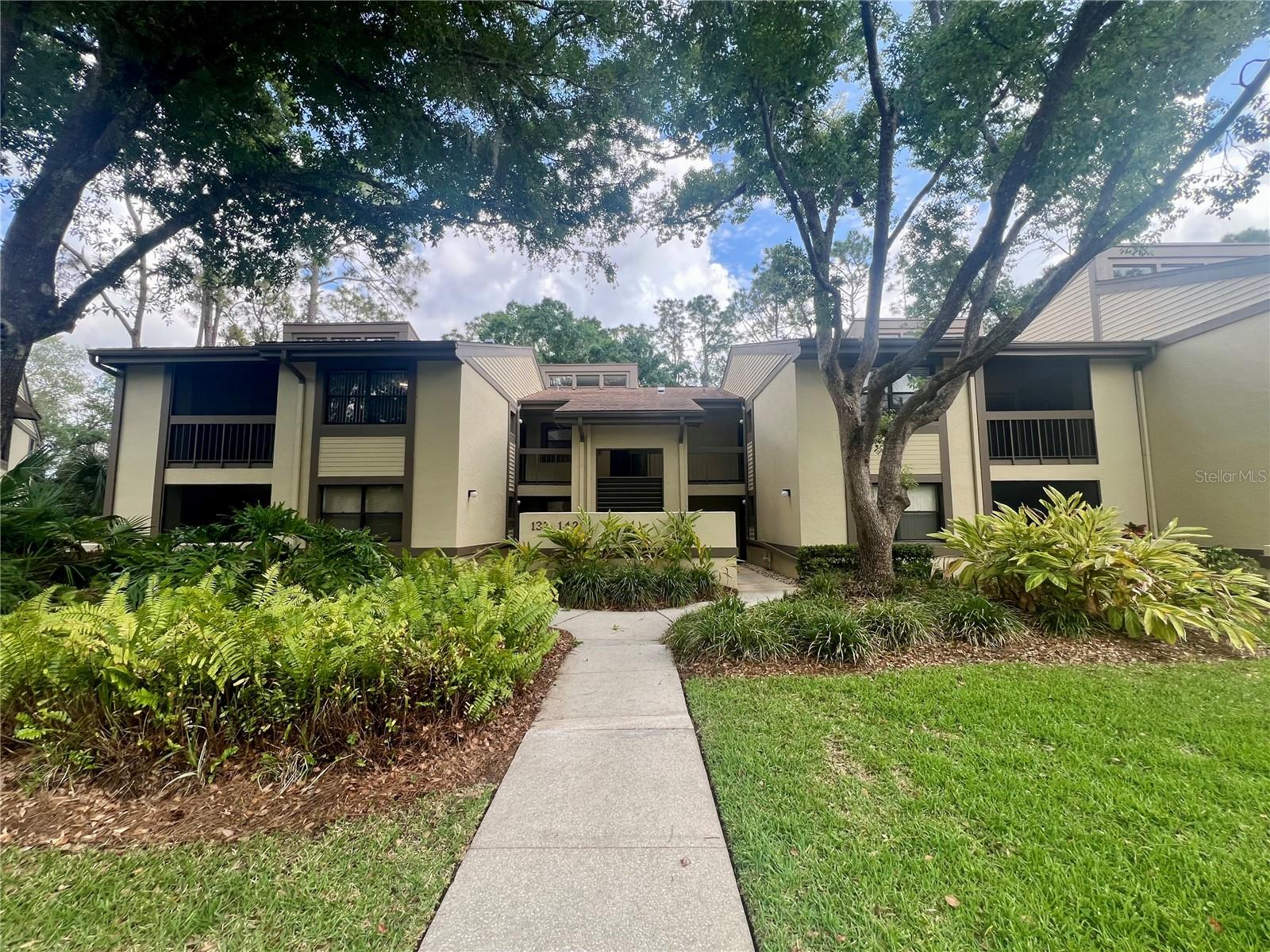 Virtually Staged. Stunning Updated Condo in the Heart of East Lake Woodlands! Experience the ultimate Florida lifestyle in this light, bright, and move-in-ready 2-bedroom, 2-bathroom condo located within the gated community of East Lake Woodlands. Whether you are looking for a permanent residence, a savvy investment, or a relaxing second home, this property delivers. Key Interior Features: • Architectural Flair: Impressive 20ft cathedral ceilings and extra-high windows flood the living space with natural light. • Modern Updates: Featuring refinished kitchen cabinets, stylish backsplash, and premium stainless steel Whirlpool appliances. • Refined Finishes: No carpet here! Enjoy easy-maintenance ceramic tile and laminate flooring throughout, complemented by updated LED lighting. • Designer Baths: Both bathrooms boast updated tile work and sleek quartz countertops. • Functional Layout: A split floor plan offers maximum privacy. The spacious master suite includes dual closets and ample storage. • Convenience: Includes a full-sized washer and dryer. Outdoor Living & Amenities: • Dual Balconies: Unique front and back screened balconies allow you to enjoy the peaceful surroundings and cross-breezes. • Prime Location: Situated directly across from the community heated pool and just a short walk to the pickleball courts. • Peace of Mind: Recent exterior updates include a newer roof and fresh paint. Location & Lifestyle: East Lake Woodlands is a premier gated community featuring a country club and championship golf course. • Travel & Beach: Just 10 minutes to pristine Gulf beaches and 25 minutes to Tampa International Airport. • Walkability: Walking distance to shopping, dining, and theaters. • Flexibility: Short-term leases are accepted, making this a rare and flexible investment opportunity.