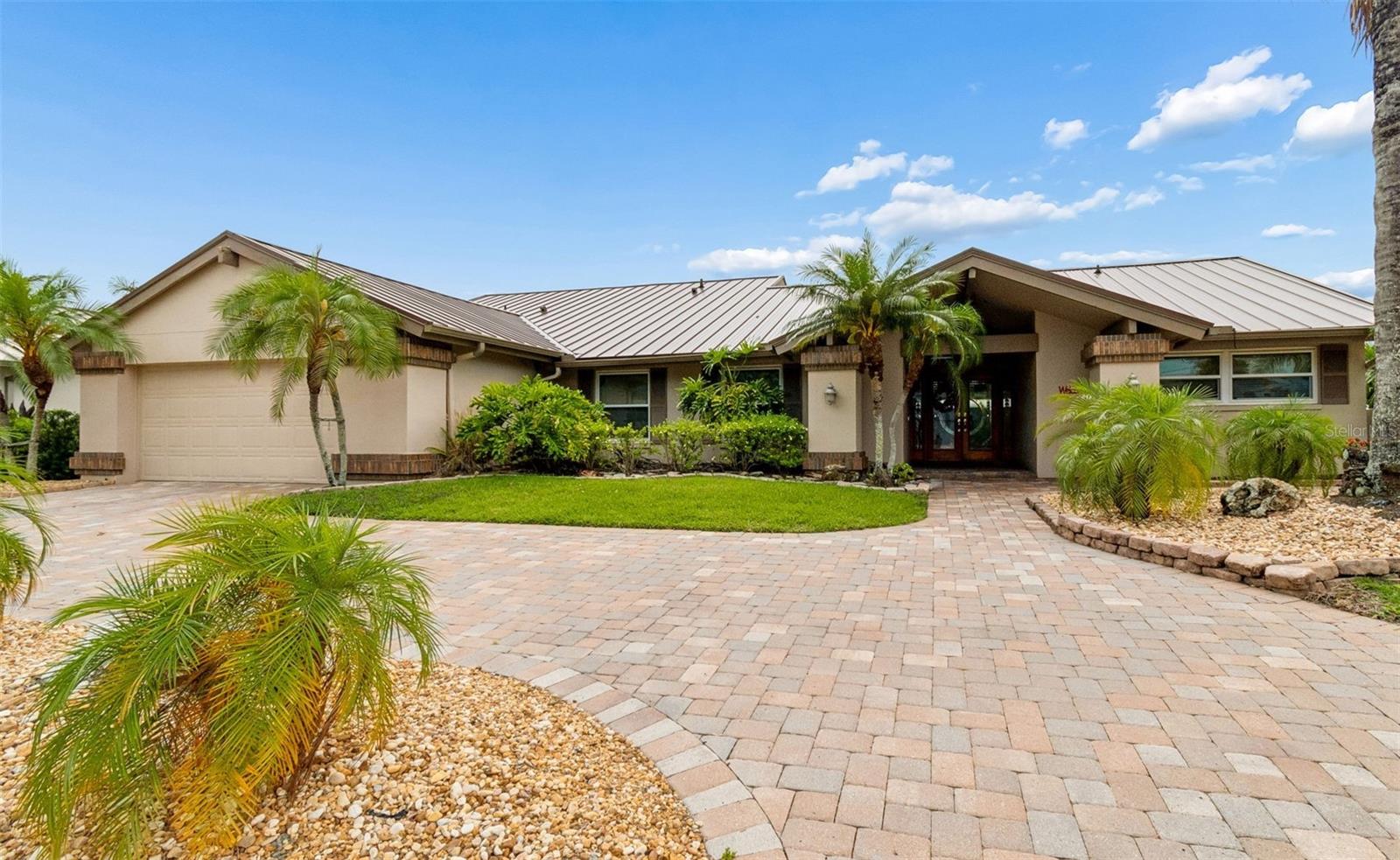 Rutenberg pool home with 4 bedrooms and 2.5 baths.
The property has 125 of waterfront with newer seawall.
Circular paved driveway with mature landscaping.
Standing seam metal roof installed 2026.
Recently painted interior and exterior.
Gas fireplace, gas tankless water heater, whole house water softener.
Kitchen: quartz counters and Shaker-style cabinetry, gas cooktop, double oven, and
stainless appliances.
Laundry room includes washer, dryer and wash tub.
Saltwater pool and heated spa, travertine pavers, built in gas grill, pergola and lighted
pool area.
TREX deck and adjoining dock with 10,000 lb boat lift.
New Daikin A/C, new electrical panel and upgraded existing electrical panel,
Pella doors and windows, Sunburst shutters and wood floors.
4 th bedroom/den with built in cabinetry,
Garage with epoxy floor and cabinetry
Dog run built into the side yard and a Backyard playhouse.
Also available is a very low hour Tri toon pontoon boat.
Only a 10-minute drive to Tampa International Airport, renowned Berkeley Preparatory School, Veteran’s Expressway, and the Courtney Campbell Causeway.  
The world-famous PINELLAS COUNTY GULF BEACHES are only 30 minutes away. Call for immediate showing.