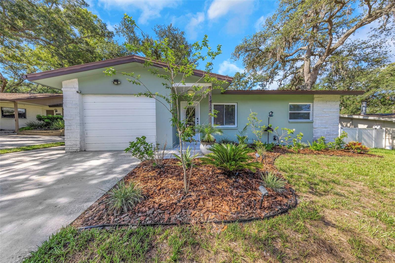 Virtually Staged. (3rd bedroom/ flex room )  Welcome to this beautifully updated 3-bedroom, 2-bath home tucked away in one of Safety Harbor's most desirable neighborhoods. High and dry with no required flood insurance and no HOA, this move-in ready home offers the perfect blend of modern updates, flexible living spaces, and an unbeatable location just minutes from vibrant downtown Safety Harbor.

Step inside to discover an inviting open-concept floor plan where engineered hardwood flooring, updated trim, abundant natural light, and neutral finishes create a warm, contemporary feel. The spacious living, dining, and kitchen areas flow seamlessly together, making everyday living and entertaining effortless.  The kitchen features a Samsung appliance package that conveys with the home, including a 5-burner gas range, gas convection oven, and French-door refrigerator, making it ideal for both everyday cooking and entertaining.

A versatile flex room currently serves as the third bedroom, offering endless possibilities as a guest suite, home office, playroom, fitness room, or media space to fit your lifestyle.

Major improvements have already been completed, including a durable metal roof, hurricane-impact windows, upgraded 200-amp electrical service, new HVAC ductwork and registers, and beautifully updated bathrooms, providing peace of mind for years to come.

Step outside and discover where this home truly shines. Relax year-round in the screened lanai or host family and friends beneath the expansive covered patio surrounded by mature oak trees. The fully fenced backyard offers plenty of room for pets, gardening, or future outdoor enhancements, while the air-conditioned workshop is perfect for hobbies, a creative studio, remote work, or additional storage.

Whether you're taking your golf cart to downtown Safety Harbor for dinner, spending the afternoon at Philippe Park, or simply relaxing beneath the canopy of mature oaks in your own backyard, this home offers the Florida lifestyle buyers dream about. Move-in ready and thoughtfully updated, this is a rare opportunity to enjoy everything that makes Safety Harbor one of Tampa Bay's most sought-after communities.   Select photos have been virtually staged.
