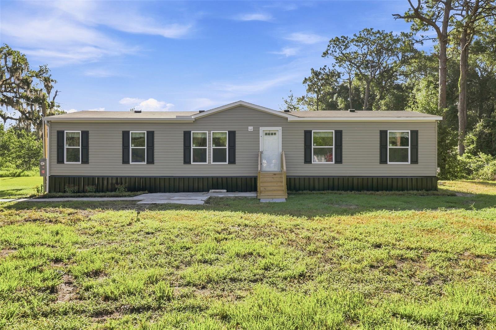 BRAND NEW 2026 manufactured home on 2.5 ACRES — NO HOA, NO CDD! This 4-bed, 2-bath home offers 1,540 sqft with an open floor plan, modern kitchen, and split-bedroom layout. Everything new from the ground up on a fully usable lot with room for toys, trucks, or animals. Quiet Shady Hills location with quick access to US-41, SR-52, and the Suncoast Parkway for an easy Tampa commute. Schedule your showing today!