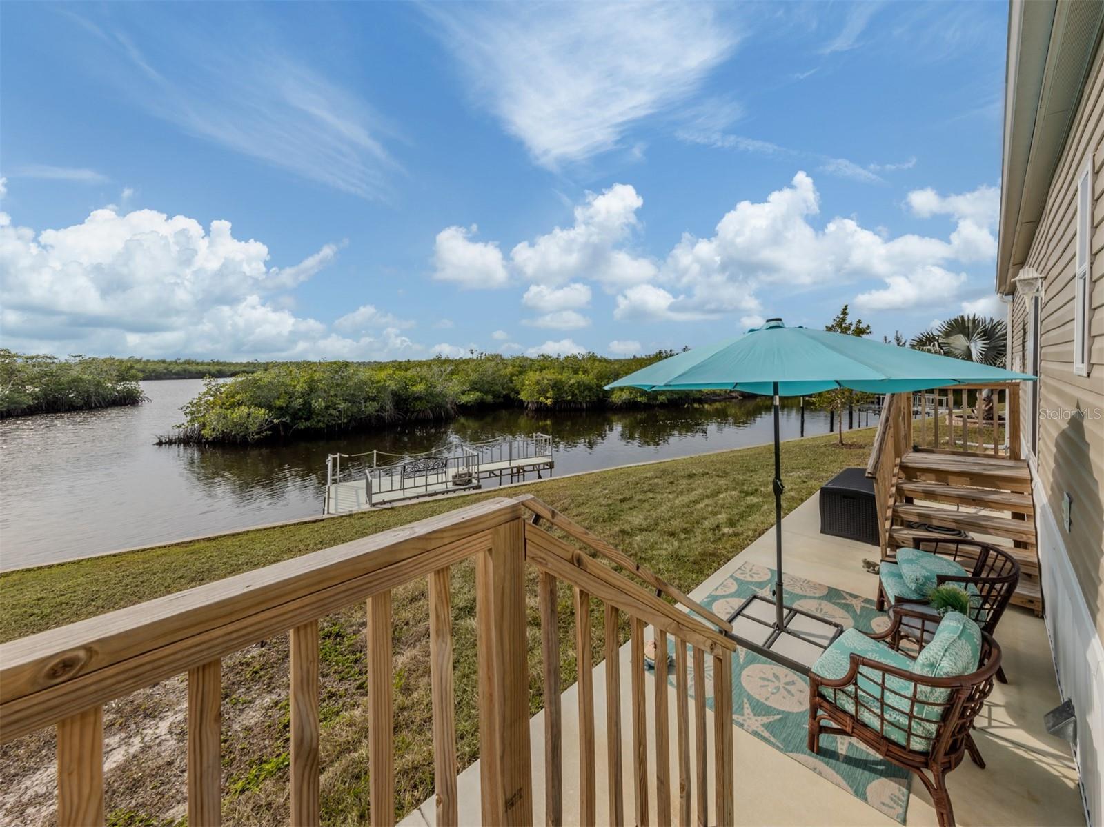 Experience waterfront living at its finest in this stunning 2023-built, 2-bedroom, 2-bath manufactured home situated along the scenic Myakka River in the highly sought-after Lazy River Village. Designed to meet the same rigorous standards as traditional wood-frame homes, this residence is built to withstand Florida’s storms while offering modern luxury and comfort.  

Inside, the wide-open floor plan is perfect for both relaxation and entertaining, featuring high ceilings with elegant crown molding and an abundance of natural light. The stylish kitchen boasts solid wood cabinetry, a spacious island, and breathtaking river views through the large sliders in the open living area. The master suite is a serene retreat, offering its own stunning water view—imagine waking up each morning to the beauty of the Myakka. A second well-sized bedroom and an inside laundry room add to the home’s convenience.  

Step outside to your private dock, where you can launch a kayak, store your boat, cast a fishing line, or simply take in the picturesque west-facing views, mesmerizing sunsets and abundant wildlife including dolphins, manatees and wading birds. The home also features a generous 364 sq. ft. garage with an attached carport, plus a charming riverside patio perfect for unwinding in the coastal breeze. To make this home truly move-in ready, most of the high-end coastal furnishings and décor are included in the sale.  

Located in Lazy River Village, a premier 55+ waterfront community, residents enjoy a wealth of amenities, including a heated pool, spa, fitness center, pickleball and tennis courts, a marina, and a clubhouse with an active social calendar. Whether you're looking for an active lifestyle or peaceful waterfront serenity, this home offers the best of both worlds. Don't miss your chance to own this slice of paradise on the Myakka!
