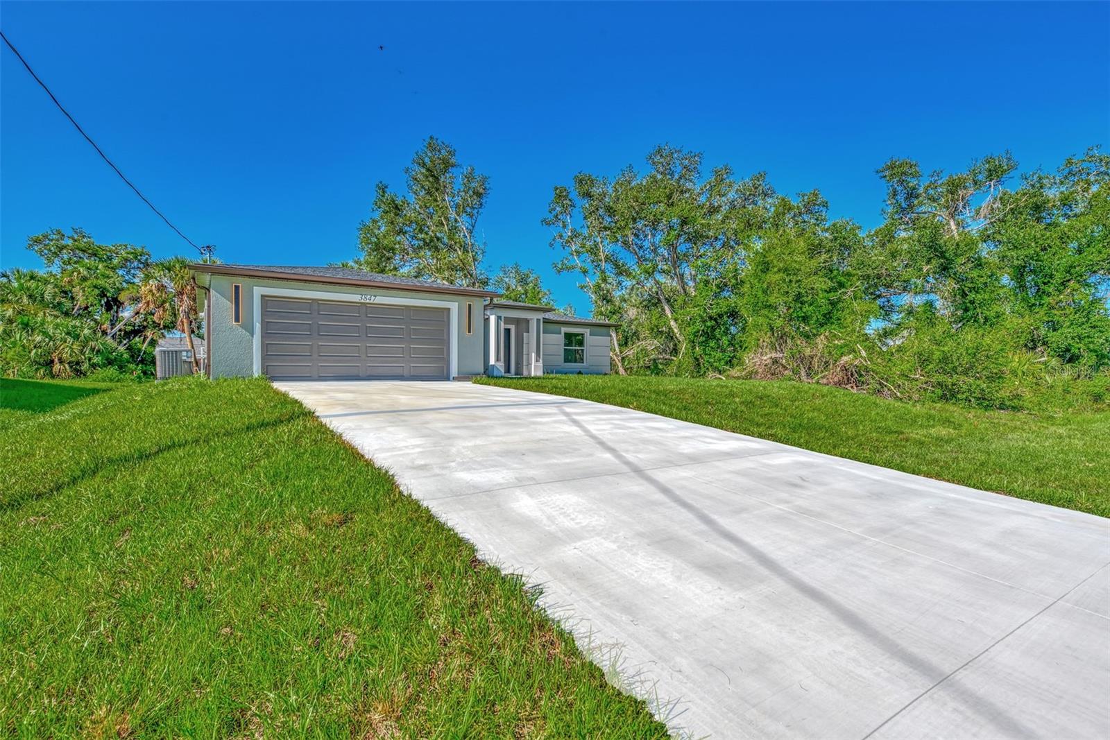 Brand new 3-bedroom, 2-bath home in North Port, FL with CITY WATER! This stunning residence features an open floor plan, quartz countertops, soft close cabinets, waterproof vinyl flooring throughout, and stainless steel appliances. The master suite includes a walk-in closet and a luxurious en-suite bathroom with tiled shower walls. Enjoy peace of mind with impact windows and the convenience of a two-car garage. The outdoor space offers ample room for activities. Conveniently located near local amenities, parks, schools, and shopping. Be the first to live in this beautiful home – schedule your showing today! $5,000 Flex cash available!
