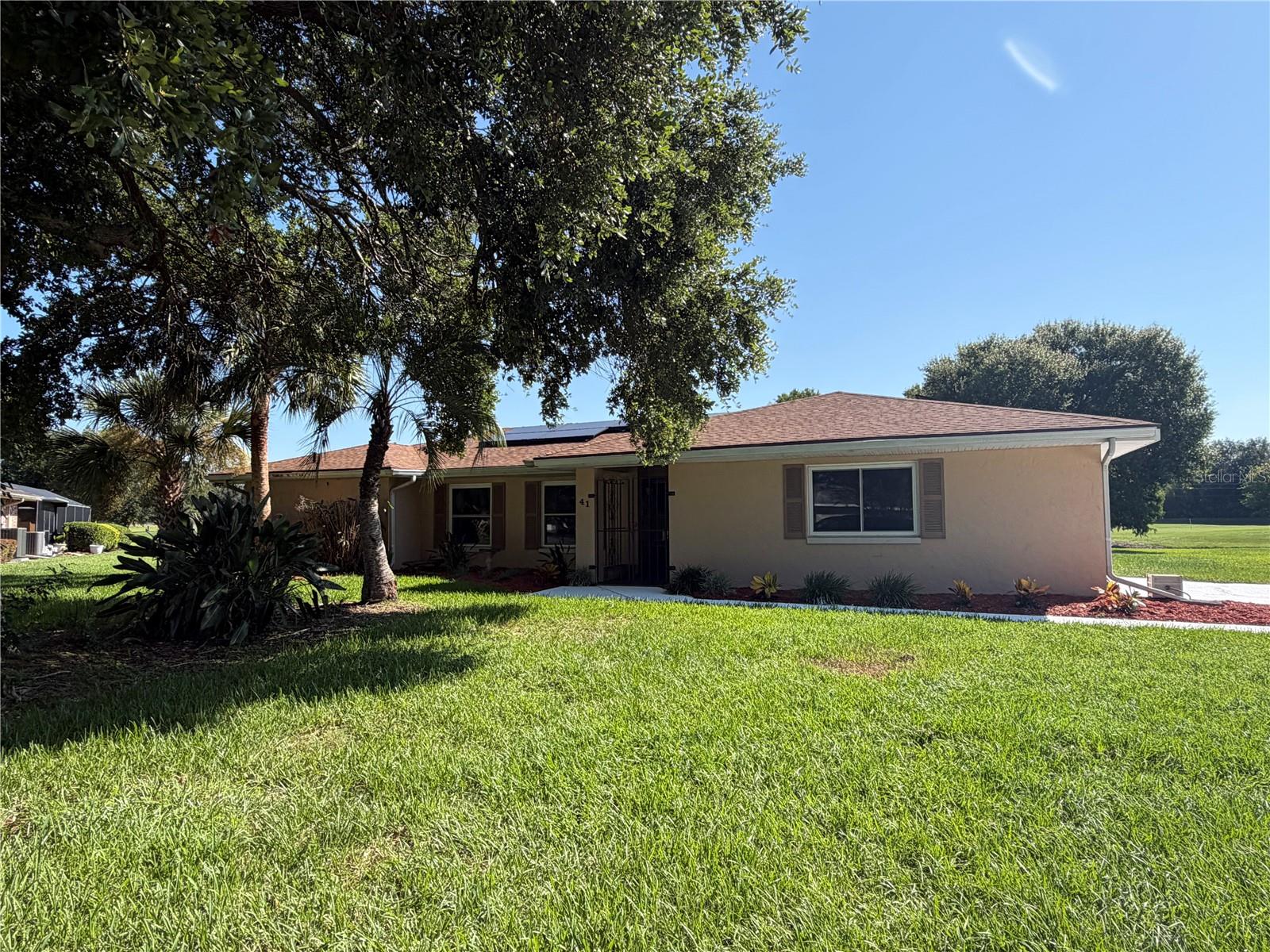Premier Location overlooking the pond and the golf course.
This traditional 3 bedroom 2 bath estate home offers split bedrooms, formal living and dining areas, large family room, master suite with dual  vanities and dual closets, oversized garage with a shower and a screen enclosed pool.
From the pool deck, enjoy watching the varied species of birds that pass by or land for a stroll/swim in the back yard or pond. Cranes, Herons, Ibis, Ducks, etc.
Recent updates include a roof, windows, water treatment system, AC including ducts and insulation, kitchen sink, disposal, bathroom faucets and toilet, rebuilt pool pump and filter system, driveaway resurfacing and garage floor embellishment as well as solar panels.