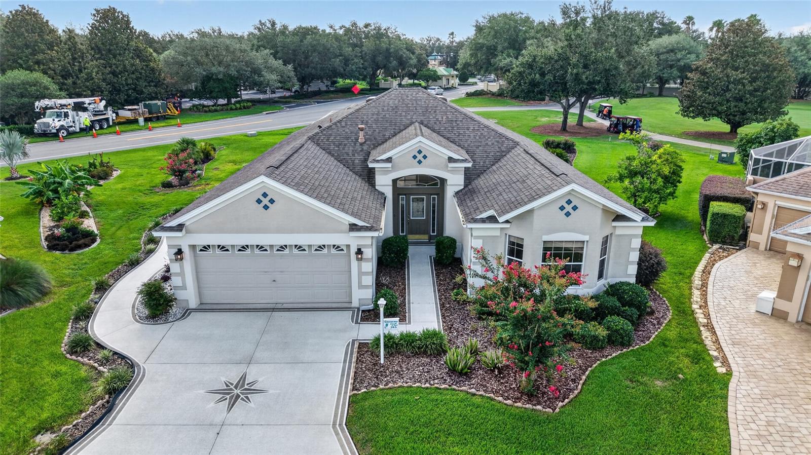 Village of Polo Ridge – Essentials … GOLF FRONT HOME – POOL HOME - BOND IS PAID!! – GREAT LOCATION! -- Belmont Designer (Similar to a Lantana Floor Plan) POOL HOME on the 9th Hole of Hawkes Bay Executive Golf Course with Side Entry Golf Cart Garage! -- This Beautifully maintained 3-Bedroom, 2-Bath home offers the perfect combination of Comfort, Style and Florida Living. -- Located on a Quiet Cul-de-sac, this Natural Gas home features a desirable golf course setting, a spacious 2-Car Garage with a Separate Golf Cart Side Entry into Garage, and numerous updates including a newer ROOF (2019), HVAC (2020), and WATER HEATER (2020). *** Inside, you'll find LUXURY VINYL PLANK FLOORING throughout the main living areas, VAULTED CEILINGS, Elegant Columns, Custom Leaded-Glass Entry Door, SURROUND SOUND, and upgraded 6-inch Baseboards. ** The bright kitchen is appointed with White Cabinetry featuring Pull-out Shelves, CORIAN COUNTERTOPS, a Breakfast Bar, and Samsung appliances, opening seamlessly to the Breakfast Nook and spacious Living Room. ** The PRIMARY EN SUITE is a Relaxing Retreat with PRIVATE POOL ACCESS, Bath with Dual Vanities/Sinks, a SOAKING TUB, Walk-in Shower, and generous Walk-in Closet. ** Guests will appreciate the Guest Wing with 2 Bedrooms, both with Closets & Hall Bath ** Step outside to your PRIVATE SCREENED BIRDCAGE/LANAI where you'll enjoy a SPARKLING POOL, an Impressive OUTDOOR WET BAR complete with QUARTZ COUNTERTOPS, Sink, Refrigerator, and ample entertaining space—perfect for hosting family and friends while taking in PEACEFUL GOLF COURSE VIEWS. ** Additional highlights include CUSTOM-PAINTED Driveway and Walkways, Mature Landscaping with Grapefruit Trees, Gutters, Irrigation System, Covered Front Porch, POLYASPARTIC COATED GARAGE FLOORING, and abundant storage. This exceptional home offers the ideal blend of Indoor Comfort and OUTDOOR RESORT-STYLE LIVING in a desirable settings in The Village of Polo Ridge across Buena Vista from the Polo Field, Saddlebrook Executive Golf Course, Pickle Ball & Softball Fields, and Saddlebrook Recreation Center, also close to all of the shopping on Rt 466 – Don’t forget the BOND has been PAID!! – Watch our walk-thru Video with Overhead Drone Photography!