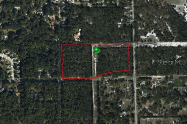 16.41 Acre Corner Lot with Favorable Residential Zoning for Development.