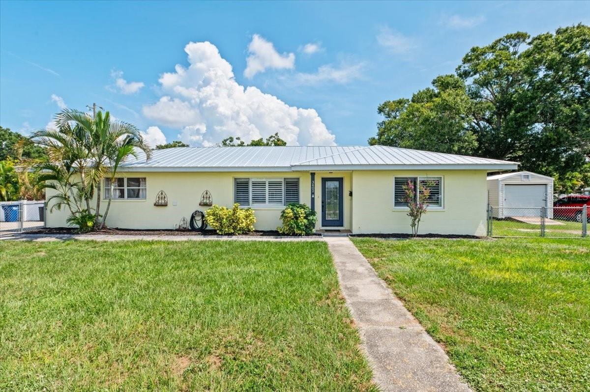 Virtually Staged. ****PRICE REDUCED…….Sellers are motivated! .Discover the rare blend of size, flexibility, and location in this spacious 4-bedroom with a den/office, 2-bath home, perfectly positioned on a double corner lot in the heart of West Bradenton. Whether you're seeking extra bedrooms for a growing household or looking to maximize income potential through short-term rentals, this home delivers.
New metal roof (2023) adds peace of mind and long-term value. Inside, the layout offers exceptional versatility. One of the bedrooms includes a private exterior entrance—ideal for a guest suite, home office, or separate rental space. Three bedrooms feature mini-split A/C units, enhancing energy efficiency and providing customized comfort for every occupant.
The interior includes a large family room offering endless potential—use it as a formal dining area, game room, or media lounge. The huge, fully fenced front yard is ready to welcome your pets, while the 10x20 freestanding workshop and storage shed (2020) provides ample space for hobbies, tools, or extra storage.
Located just minutes from the Gulf beaches, hospitals, and local shopping, and one block from Manatee High School, this home offers an unbeatable combination of convenience, comfort, and opportunity.