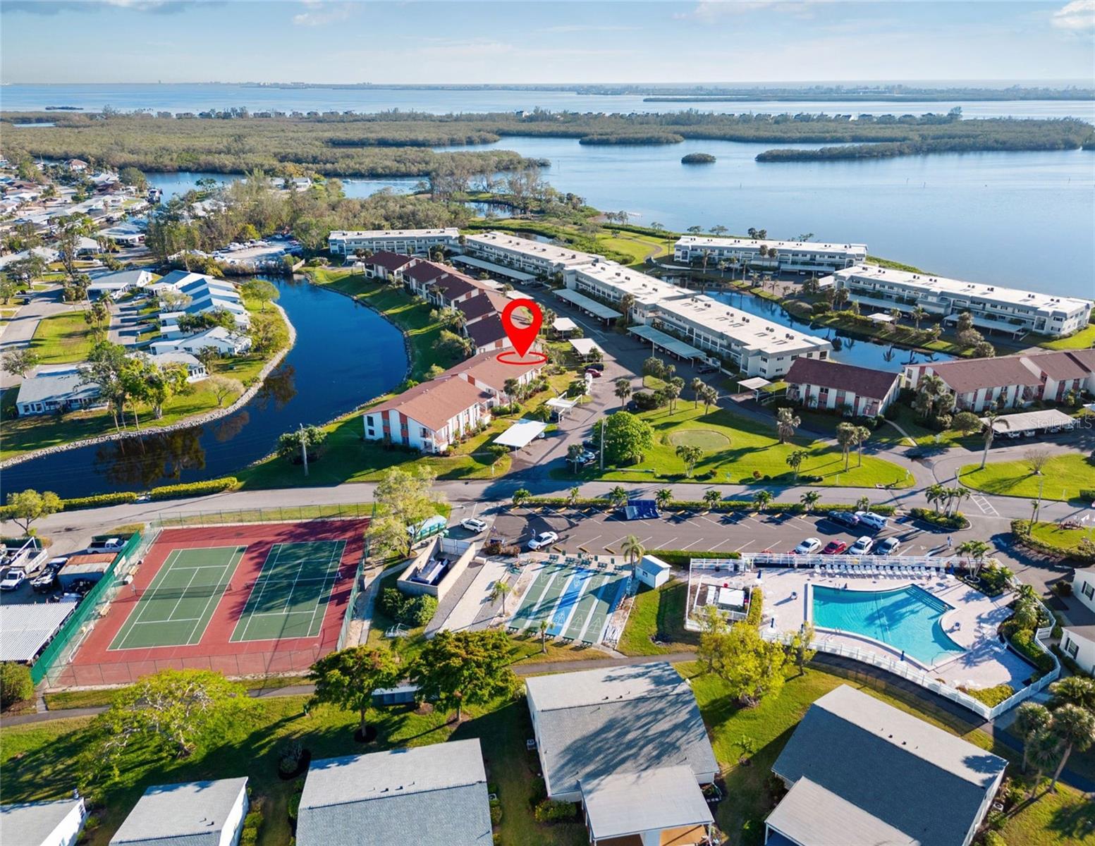 MOTIVATED SELLER INCENTIVE: FULL YEAR OF HOA FEES CREDITED TO BUYER AT CLOSING! MOVE IN READY, ONE LESS THING TO WORRY ABOUT!

Your Coastal Reset Starts Here: Freshly renovated corner unit. Pond views. Bay glimpses. Heated pool steps away. Beaches 5 minutes down the road. And zero HOA worries for your first year.

This 2bed/2bath is your blank canvas for Florida living. Brand new luxury vinyl throughout. Quartz countertops. Fresh fixtures and paint. The enclosed lanai? That’s your flexible sanctuary, home office, reading nook, morning coffee spot, whatever you dream it.

Why Mount Vernon: A 90 acre waterfront haven with heated resort pool, pickleball, tennis, boat slips, kayak launch, butterfly garden, nature trails, and a vibrant active community. Your HOA includes everything cable, internet, water, sewer, pest control, landscaping, exterior maintenance. Maintenance free living at its finest

The lifestyle: Anna Maria Island’s sugary beaches are a quick bike ride or 5 minute drive. The clubhouse has game rooms, a library, banquet space. There are activities, socials, and a community that actually gathers.
This isn’t just a condo. It’s a coastal lifestyle reset with the seller removing one major financial hurdle for you.

Come see why life at Mount Vernon feels like vacation every day