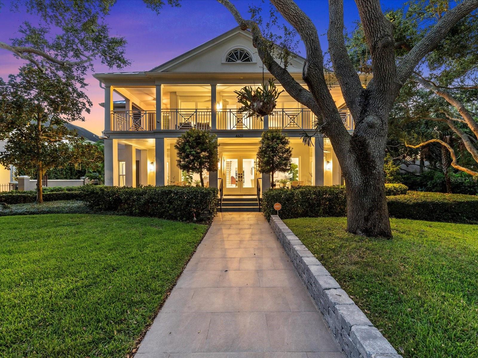 HIGH AND DRY! Have the best of both worlds- this waterfront Bayshore mansion is fully updated and completely storm-prepped! Located on one of the very few Bayshore lots in an unshaded flood zone X, this corner lot is over 16 ft above sea level (Flood cert attached).  This gorgeous solid concrete block home is also equipped with impact rated windows and doors, a newer metal roof, hurricane shutters for extra protection, and a whole house generator. There was no damage or flooding from either Helene or Milton. Inside, you’ll enjoy elegantly updated features throughout; this home has been completely remodeled over the past couple of years with no detail overlooked or expense spared. A gracious, flowing floor plan downstairs is ideal for entertaining, showcasing the breathtaking Bayshore views. The kitchen boasts custom walnut cabinetry, Thermidor appliances, and a custom wet bar with fully integrated Thermidor wine refrigerator, coffee station, and refrigerator & freezer drawers. The gas range with electric convection oven + built in convection oven and microwave/oven will be a chef’s delight, and there’s plenty of space around the oversized island for everyone to gather and enjoy. In addition to the kitchen, the main level offers a family room, formal living room, formal dining room, office/study with built-ins, powder bath and an en-suite guest bedroom with three-quarter bath, all mindfully designed to maximize views of the glittering Bay and punctuated with luxurious marble flooring. A fully integrated Sonos sound system enhances everyday living. Enjoy entertaining and lounging by the private and oversized pool, with a lovely covered dining space and tropical gardens. Upstairs offers an additional four large bedrooms, each with their own bathrooms; for a total of five bedrooms + 5.5 bathrooms (+ office) throughout this grand home. Wake up each morning in the upstairs primary suite to the stunning views of Tampa Bay then step out onto your upper balcony to welcome the day. The bathroom of the primary suite is a sublime spa-like experience, with custom cabinetry, a gorgeous soaking tub, with marble and porcelain finishes throughout. Those who love organization will appreciate the bespoke details of the fully customized walk-in primary closet. Car enthusiasts and those who love entertaining will be thrilled with the more than ample parking available in both the front and back of the house. The welcoming circular driveway in front can comfortably accommodate eight (8) vehicles, and the two car, rear-entry garage is accessible via the private road (shared with only a few neighbors to the rear of the house). Additional space in the rear dive and parking pad can accommodate up to another six vehicles, for a total of approximately fifteen (15) parking spaces. You’ll enjoy strolling just a couple of short blocks to dinner at Stovall House, or take advantage of the undeniable conveniences of South Tampa’s upscale shopping, restaurants, events, and nightlife. This incredible home offers it all… peace of mind and perfectly turnkey. Welcome home!