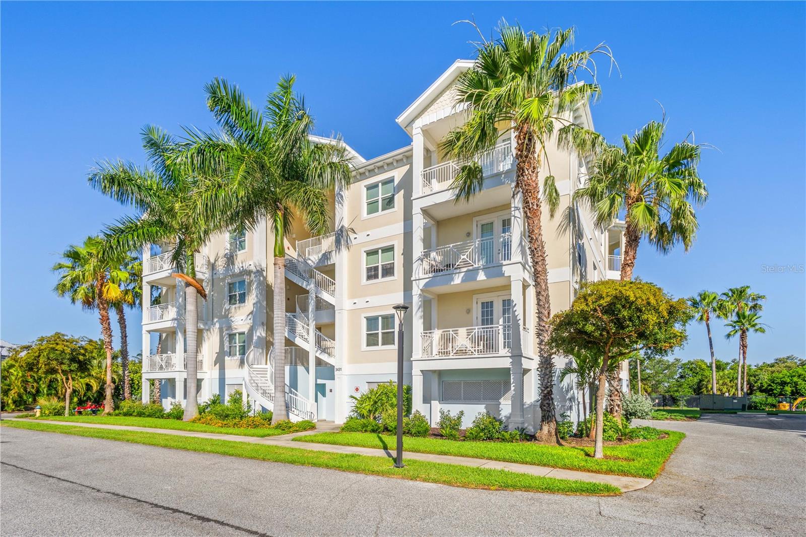 Welcome to your coastal retreat in the gated community of Palma Sola Bay Club, This tropical inspired community, where luxury resort living feels like you are on vacation. This beautifully appointed three-bedroom, two full bath, and one half bath residence offers 1,857 square feet of elegant coastal living designed for comfort, style, and relaxation.  From the moment you enter, you’ll appreciate the light-filled open floor plan, soaring ceilings, and upscale finishes throughout. The spacious living and dining areas are framed by expansive windows that invite in natural light and create a warm, airy ambiance. French doors from both the living room and the luxurious primary suite open to a private balcony, offering the perfect setting to enjoy morning coffee or unwind with peaceful sunset skies.  The designer kitchen is both functional and sophisticated, featuring granite countertops, solid-wood cabinetry, stainless-steel appliances, and a large breakfast island ideal for casual dining and entertaining. The serene owner’s suite serves as a private sanctuary with a spacious walk-in closet and a spa-inspired bath complete with dual vanities, a soaking tub, and a separate walk-in shower. Guests will appreciate the thoughtfully designed secondary bedrooms, including one with an adjacent full bath for added privacy and comfort.  Additional highlights include a spacious half bath conveniently located off the main living area, two assigned under-building parking spaces near the elevator, and flood insurance included within the HOA fees.  Beyond the residence, Palma Sola Bay Club delivers an unmatched coastal lifestyle surrounded by 30 acres of preserved natural beauty, tropical landscaping, scenic lakes, and breathtaking bayfront amenities. Residents enjoy access to a private observation deck and kayak launch overlooking Palma Sola Bay, a dog park, and an impressive two-story clubhouse featuring a fitness center, billiards room, social lounge, and entertainment kitchens.  Outdoor amenities rival those of a luxury resort, including a heated swimming pool with an expansive sun deck, fire pit lounge, bocce court, wet bar, grilling area, and gathering spaces designed for entertaining and connection. Ideally located in West Bradenton, you’re just minutes from the pristine Gulf beaches of Anna Maria Island, while fine dining, shopping, golf, and cultural attractions are all conveniently nearby.  Experience the perfect blend of luxury, leisure, and coastal elegance in one of Bradenton’s most sought-after waterfront communities. Being sold furnished minus a few personal items.  See attachment in the MLS.