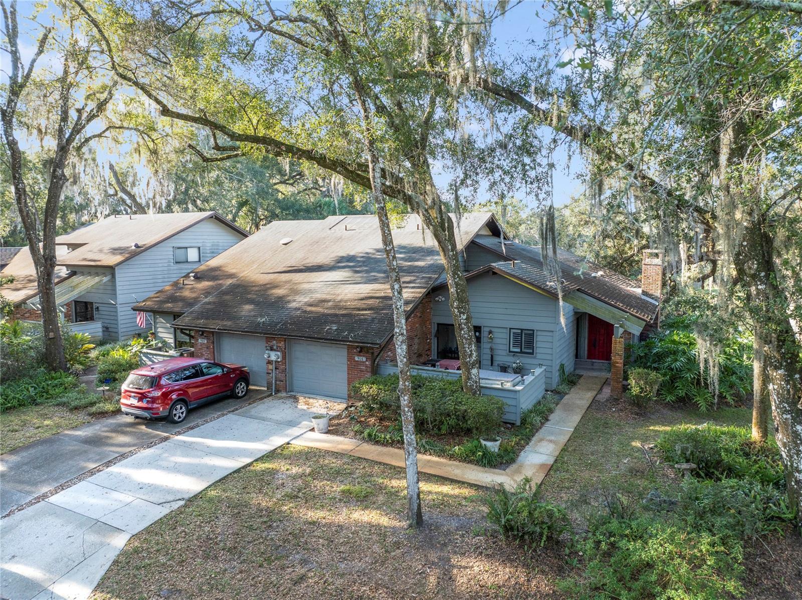 Amazing 2 Bedroom/2 Bathroom Town-home In a beautiful Condo Community. This home is only one of 36 units. Very private and very nicely kept. Unique Pond and and Woodlands views. Private road and fully landscaped. This is a single point of access community just Northeast of Deland. This single family unit has it all. Two nice sized bedrooms with each having its own private bath. Spacious Great room/Dining combo, Private screened-in sun room, Large eat-in kitchen, Engineered Hardwood floors, Stainless steel appliances, Sliding door access to the sun room and front lanai, Inside utility with washer and dyer, that has direct access to the oversized one car garage. There is a office/sitting room as well. You have a floor to ceiling fully functioning fireplace. Hot-water heater 2019, HVAC is only 4 years old, Roof and exterior are maintained by the HOA. The HOA has a 15 year plan that keeps the roof new each cycle. Downtown Deland is just 8 minutes away with its unique shops and restaurants plus, Stetson University. . There is an Advent Health Hospital minutes away and much shopping within a 5 mile radius. The Atlantic beaches are just 30-35 minutes away and the Daytona Speedway is just 20 minutes down 1792. So much to do in this area.