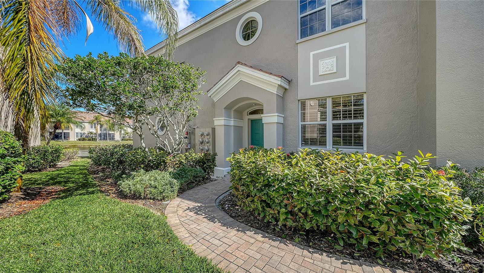 Move right into this freshly renovated first-floor condominium in the heart of Palmer Ranch! Featuring luxury vinyl flooring throughout, new stainless steel appliances, upgraded light fixtures and freshly painted walls, this home is ready to enjoy! With a light, airy palette and peaceful views of the lake, you will enjoy relaxing on the screened-in lanai. The bright kitchen is fully updated with classic white cabinetry, quartz countertops, undermount sink and recessed lighting. The oversized primary bedroom suite, boaters’ view of the lake and plantation shutters for privacy. With a large walk-in closet, a soaker tub, shower and dual vanities in the primary bath, this suite has everything you need. Just bring your clothes! Two additional spacious bedrooms, a second bath and an inside laundry complete this home. The attached one-car garage provides additional storage and has an oversized driveway that parks two vehicles. The roof was replaced in 2023. Botanica is a gated condominium community in Palmer Ranch. Community amenities include two pools, a clubhouse and fitness room and lush, well-maintained landscaping.