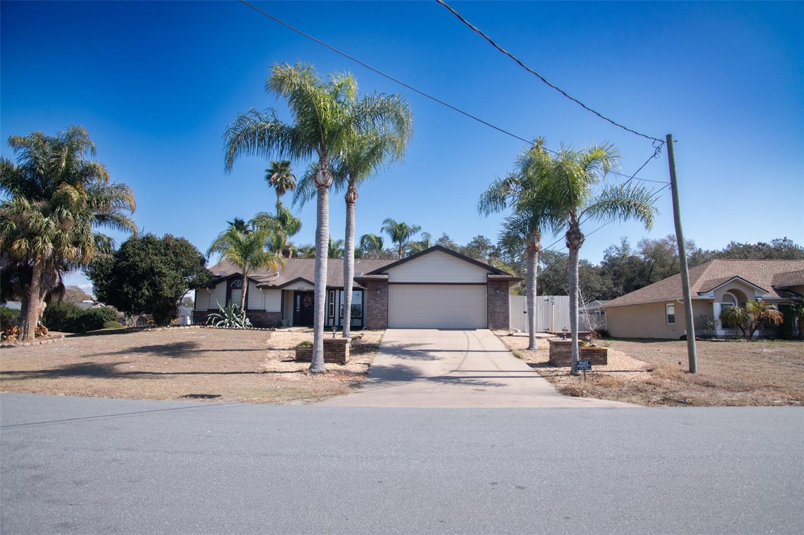 Back on the market is this beautiful spacious home features a 3BR/2BA split plan with a swimming pool, hot tub /spa and outdoor kitchenet to entertain your guests. This home sits on a 0.6-Acre corner lot in a NO FLOOD zone. Elevation is 25Ft. Back yard completely fenced  with 3 access gates for RV's, boats and trailers and has a large shed/shop supplied with electric.