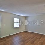 Exceptional opportunity for investors, business owners, or those seeking a live-work property! Situated on approximately 0.99 acres with 200 feet of road frontage across four 40-foot parcels, this rare offering is located in Edgewater's established Florida Shores commercial district between U.S. 1 and the railroad corridor. The property features a grandfathered residential duplex, allowing residential use to continue as long as it remains in continuous use. The existing structure also offers the flexibility to convert to commercial use, creating endless possibilities for future owners. Recent improvements include new electrical panels in both units (September 2025), a new roof installed in 2018, and complete HVAC system replacements for both units in 2018. The duplex and adjoining lot are being sold together, providing ample space for expansion, parking, storage, or redevelopment. Commercial zoning allows for a variety of potential uses, including professional offices, contractor operations, auto repair, machine shops, service businesses, and other light industrial applications. Buyers should verify intended uses with the City of Edgewater. Conveniently located less than 3 miles from the I-95 interchange, the property offers excellent accessibility for customers, employees, and deliveries. It is also close to shopping, the public library, schools, the Halifax River, parks, and numerous recreational opportunities. Whether you're looking for an income-producing investment, a future business location, or both, this versatile property offers location, flexibility, and exceptional potential in one of Edgewater's growing commercial corridors.