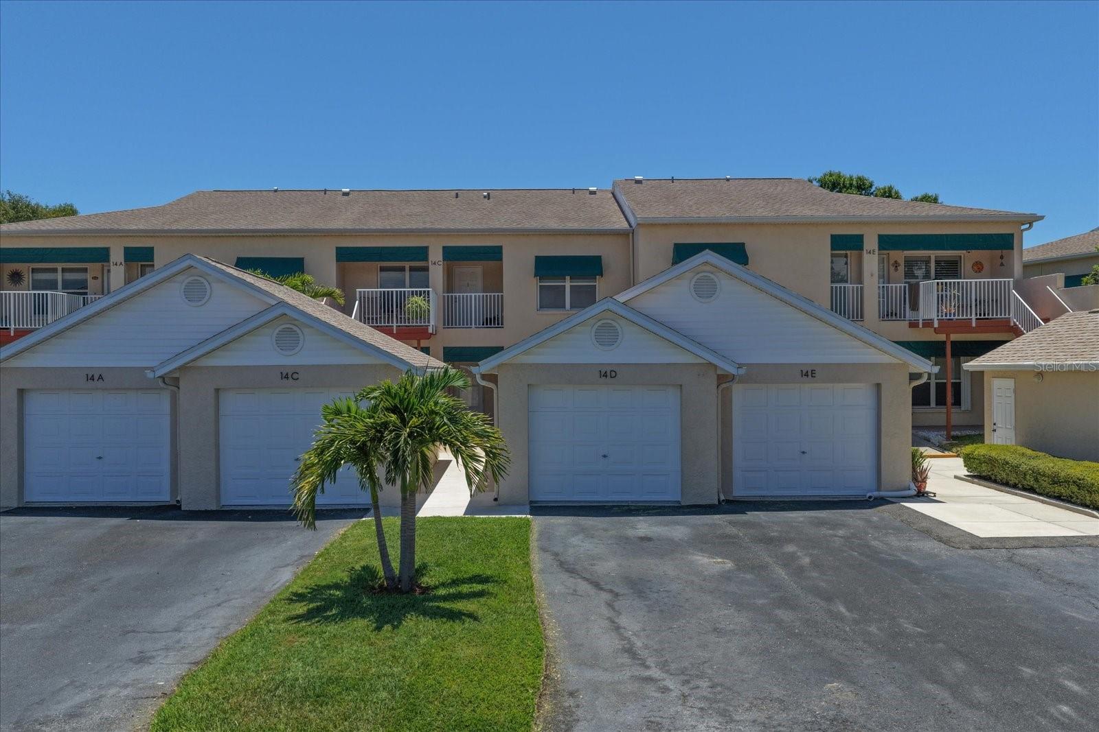 Welcome to this beautifully maintained and professionally staged first-floor condominium offering the perfect blend of comfort, convenience, and Florida living. This spacious 2-bedroom, 2-bath residence is located within the highly desirable gated community of Shores of Long Bayou and features a thoughtfully designed split-bedroom floor plan, soaring 9.5-foot ceilings, abundant natural light, and peaceful pond views.

From the moment you enter, you'll appreciate the open and inviting layout that seamlessly connects the living and dining areas, creating an ideal space for both everyday living and entertaining. The spacious primary suite serves as a relaxing retreat with generous closet space and a private en-suite bath, while the split-bedroom design provides added functionality and privacy for guests or a home office. An interior laundry closet with washer and dryer adds everyday convenience.

Step outside to your screened lanai and private deck overlooking the tranquil pond, where you can enjoy your morning coffee, unwind after a long day, or simply take in the beauty of the surrounding nature. The rear of the home offers an exceptional sense of privacy, creating a peaceful outdoor setting rarely found in condominium living.

Additional features include electronic hurricane shutters for added protection and convenience during Florida's storm season, as well as a detached one-car garage with a private driveway, providing valuable storage and parking options.

One of the property's most appealing features is its close proximity to the Pinellas Trail, offering easy access to miles of scenic pathways for walking, jogging, biking, and outdoor recreation. Whether you enjoy an active lifestyle or simply appreciate having nature and green space nearby, this location is hard to beat.

Residents of Shores of Long Bayou enjoy access to an impressive collection of community amenities, including two resort-style swimming pools, a fitness center, clubhouse, walking paths, and beautifully maintained grounds. The community welcomes residents of all ages and is ideally located near shopping, dining, parks, medical facilities, and everyday conveniences. Plus, some of Pinellas County's most beautiful Gulf beaches, including Madeira Beach and Indian Rocks Beach, are less than 15 minutes away.

As an added bonus, the home is professionally staged, and the furnishings are available for purchase separately, offering a unique opportunity to enjoy a move-in-ready experience.

Whether you're seeking a full-time residence or a seasonal Florida getaway, this exceptional home offers peaceful water views, outstanding amenities, convenient access to the Pinellas Trail, and a low-maintenance lifestyle in one of Seminole's most desirable gated communities. Schedule your private showing today and discover all that this beautiful property has to offer. Please note this is NOT a 55+ community. All ages welcome!