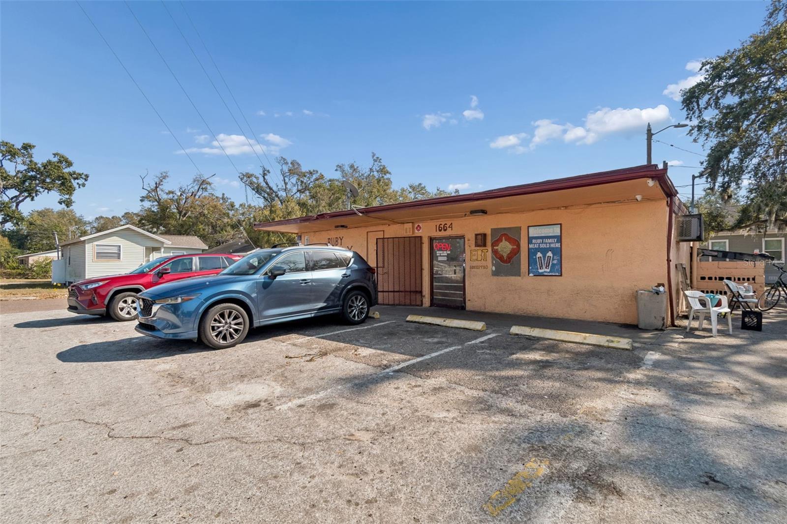Prime opportunity to own a freestanding commercial building just 2 miles from downtown St. Petersburg. This corner-lot property offers approximately 1,740 square feet of heated space and 2,060 square feet total, with great visibility, ample parking, and a flexible layout suited for a variety of retail or service uses.

The sale is for the real estate, but the current convenience store operation may be included at no additional cost if a buyer wishes to continue the business. Much of the existing equipment—including three refrigerators, a meat freezer, meat slicer, ice cooler, scale, and wrapping machine—will convey and is considered a bonus with the purchase. The ATM and ice-cream cooler do not convey. All inventory will be removed prior to closing unless a buyer chooses to purchase it separately.

Located within an Opportunity Zone, this property may qualify for valuable investment incentives, grants, or financing programs for buyers who meet program requirements.

Sold As Is. Whether you’re an investor, owner-operator, or entrepreneur ready to bring a new concept to life, this property offers outstanding visibility, flexibility, and long-term potential in a growing St. Petersburg location.
