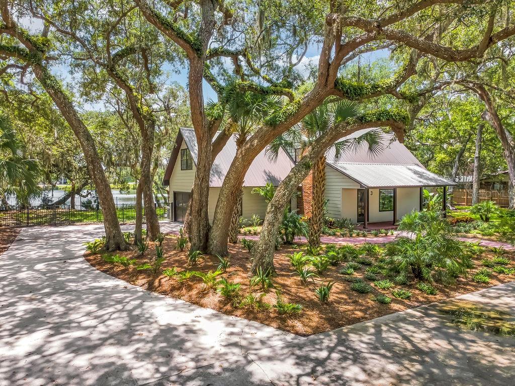 Welcome home to one of St. Augustine's Beach most special waterfront retreats. From the moment you walk through the front door, you'll know you've found the one. Every room draws your attention to the breathtaking views of spring-fed Lake Anhinga, where peaceful waters and natural beauty create a truly unforgettable setting. Tucked away on a quiet, private road, this home offers the perfect blend of character, charm, and tranquility. The picturesque, park-like property is surrounded by beautifully designed zero-scape landscaping, providing year-round beauty with minimal maintenance. Spring-fed Lake Anhinga is a rare gem in St. Augustine Beach, making this an exceptional opportunity to own a home in one of the area's most unique and serene locations. Whether you're enjoying your morning coffee overlooking the water or unwinding as the sun sets across the lake, this is where lasting memories are made and everyday feels like a retreat.